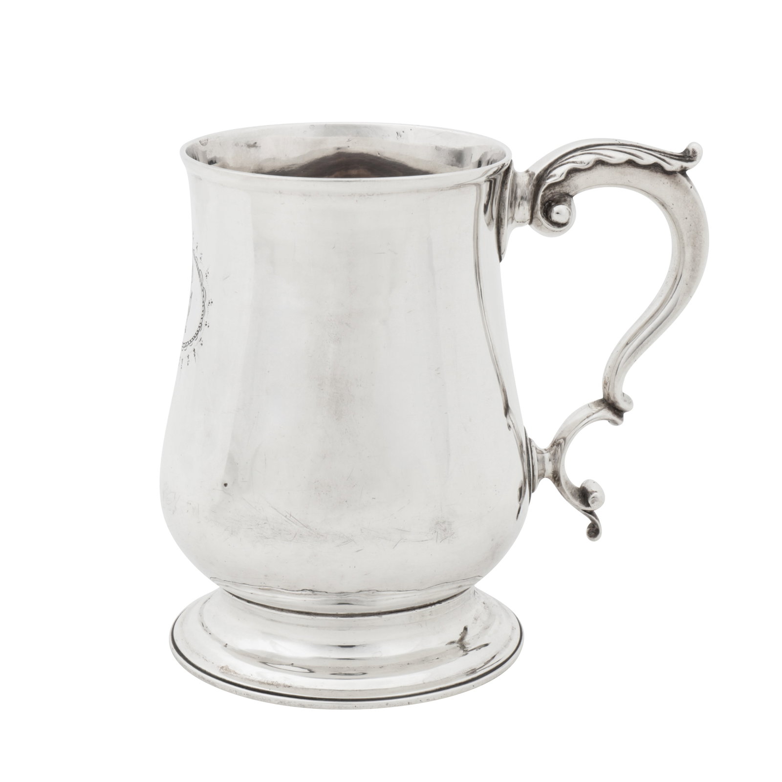 London 1790 by James Mince A George III sterling silver mug: London 1790 by James Mince A George III sterling silver mug Of baluster form with a caulked rim upon a spreading circular foot, with a leaf capped double C scroll handle. Engraved to the front with a 