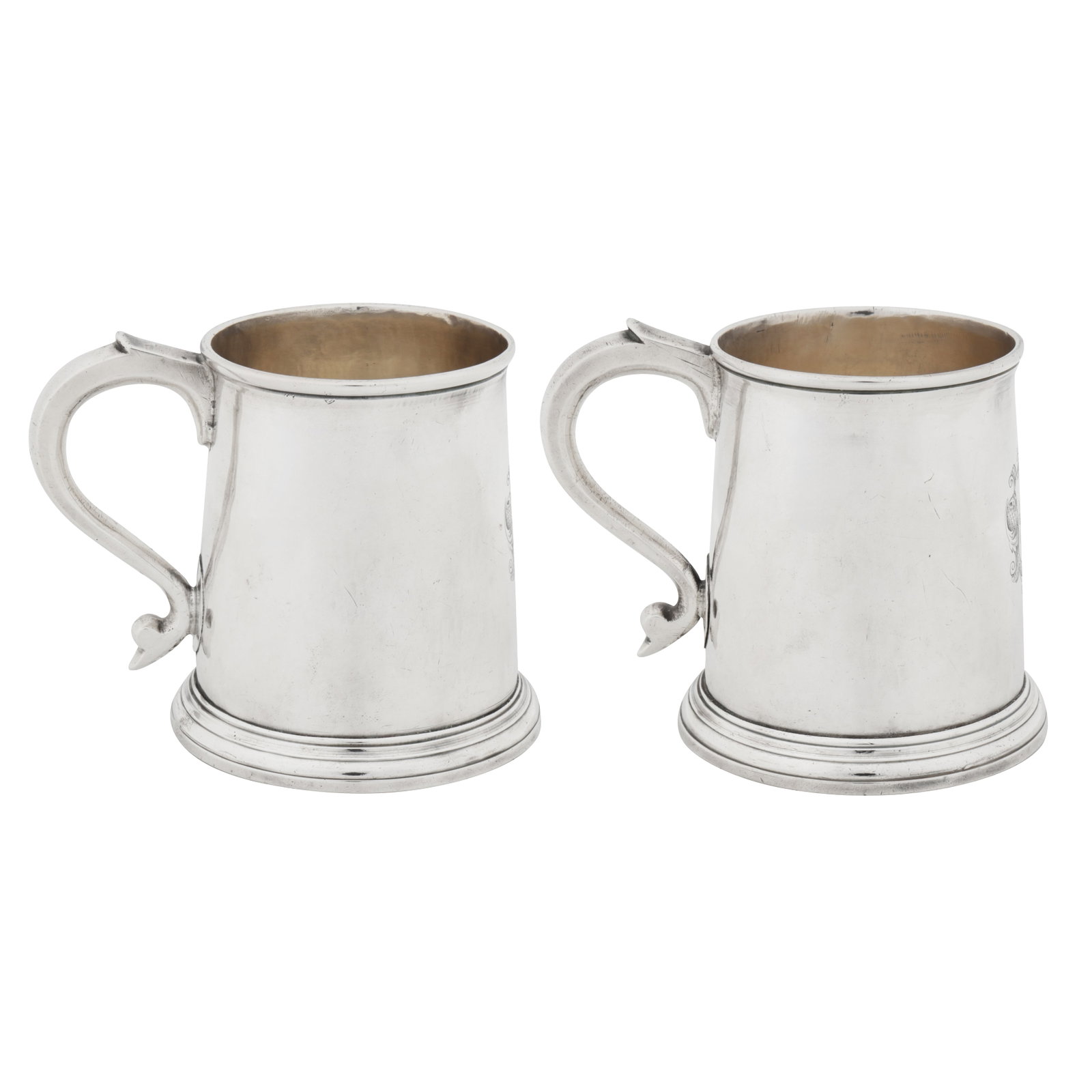 London 1723 by Thomas Morse A pair of George I sterling silver half pint mugs: London 1723 by Thomas Morse A pair of George I sterling silver half pint mugs Each of tapering cylindrical form upon a spreading circular foot, C scroll handles with moulded rims. Each engraved to the