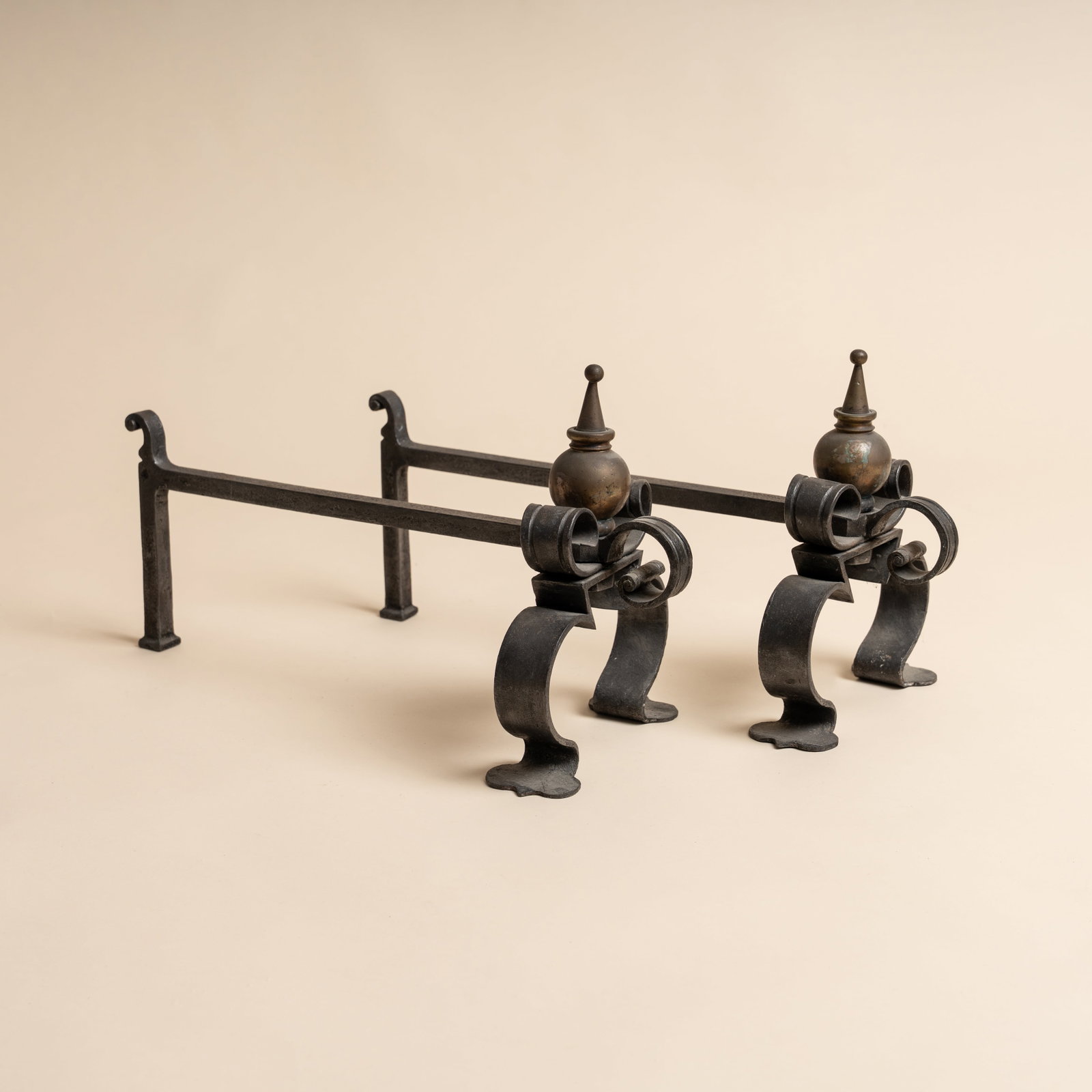 Arts and Crafts, Britain Pair of Fire Dogs: Late 19th / early 20th century Iron, brass 26cm high x 20cm wide x 49cm long Preview: Barley Mow Centre Provenance: From a private collection, London