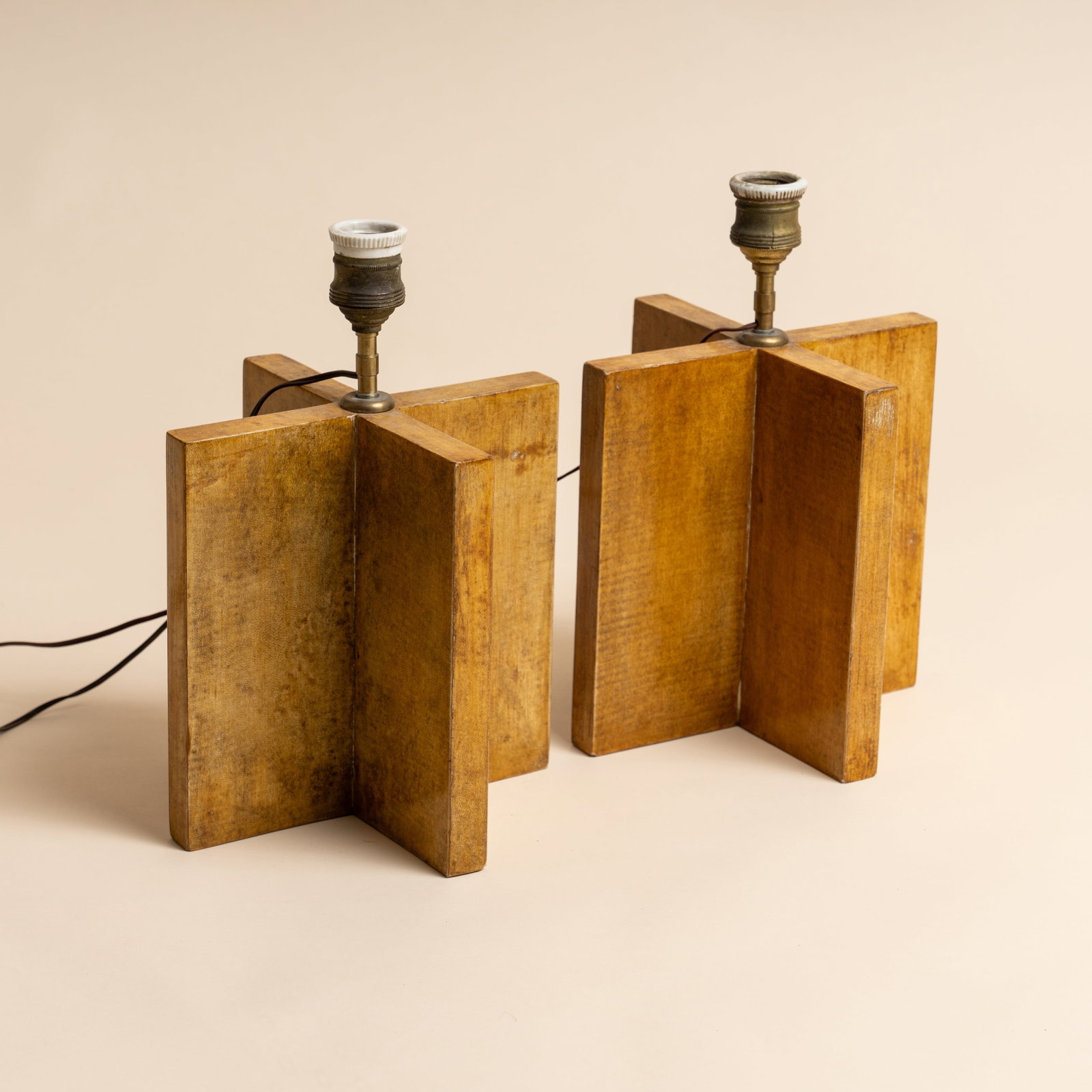 COMTE, Argentina Pair of 'Croisillon' table lamps: 1935 Vellum parchemin, oak, tubular brass 30cm high x 22cm wide x 22cm deep Provenance: The collection of Mo Amelia Teitelbaum Mo is a collector, researcher and author who specialises in the period th