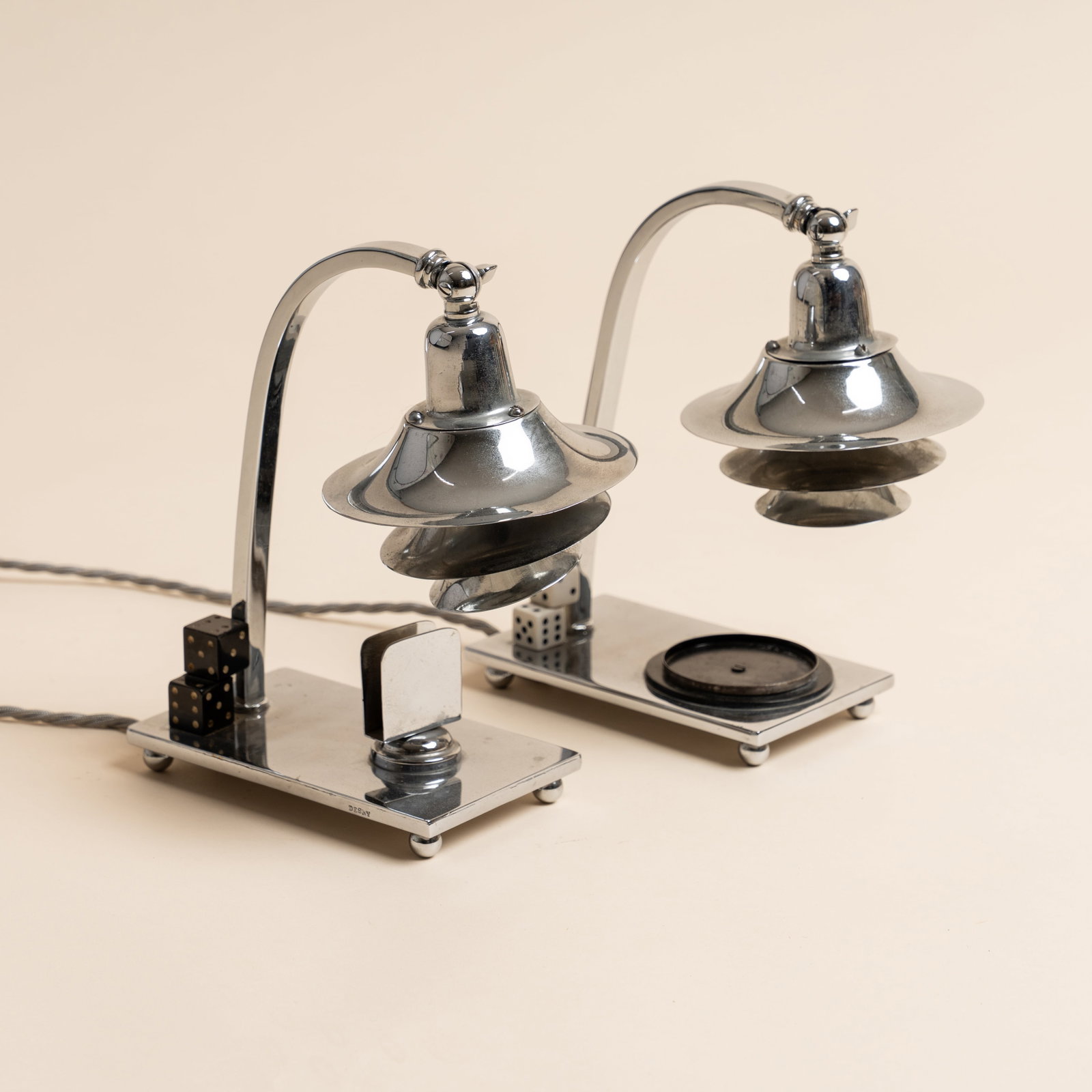 Maison Desny, Paris Pair of table lamps: Circa 1920s Chrome, bakelite Stamped 'DESNY' 20cm high Preview: Barley Mow Centre Provenance: From a private collection, London