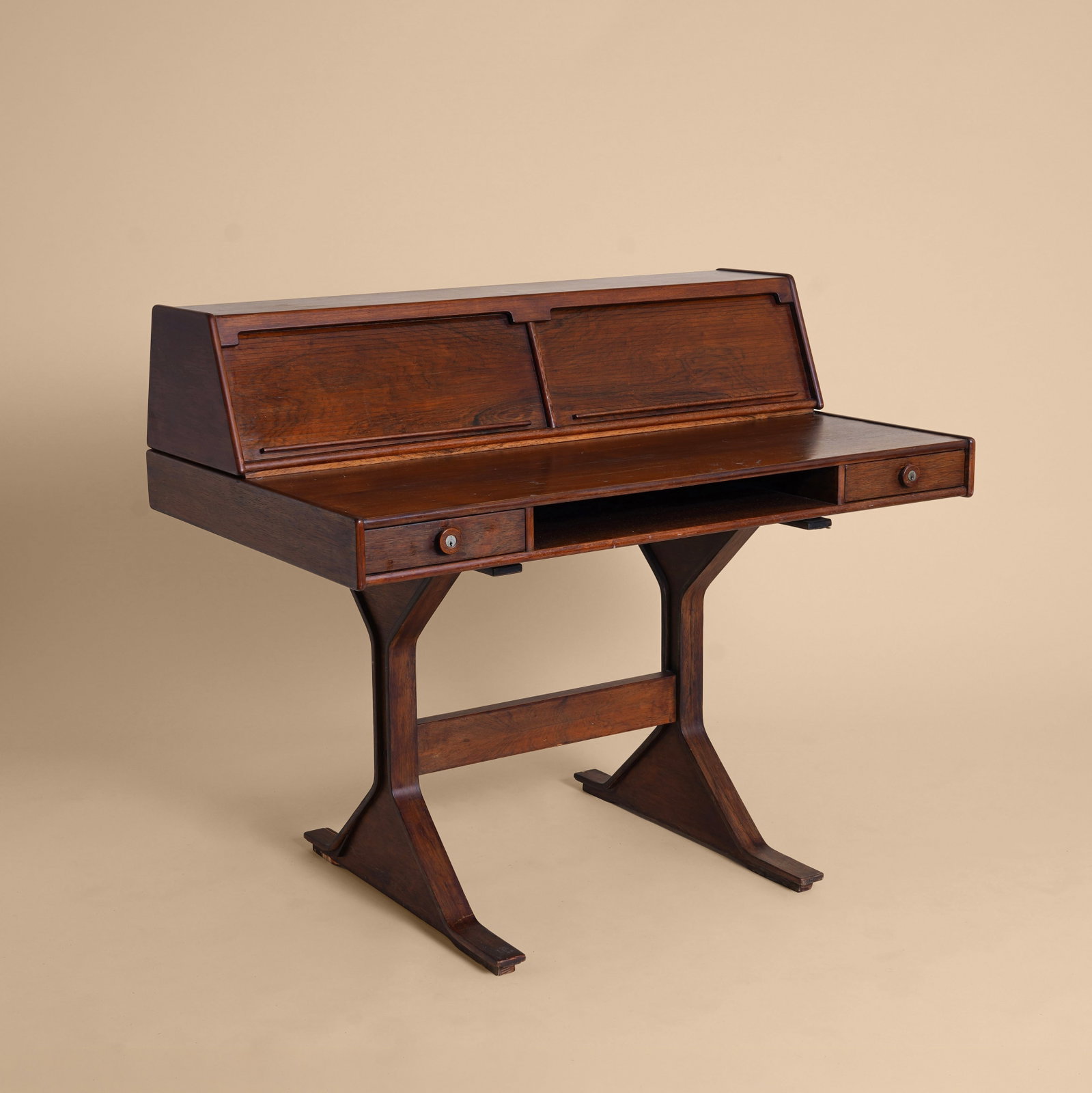 Gianfranco Frattini (Italian 1926-2004) for Bernini, Italy Model 530 Desk: 1957 Rosewood, mahogany, brass 94cm high x 130cm wide x 80cm deep Provenance: From a Distinguished Private International Collection