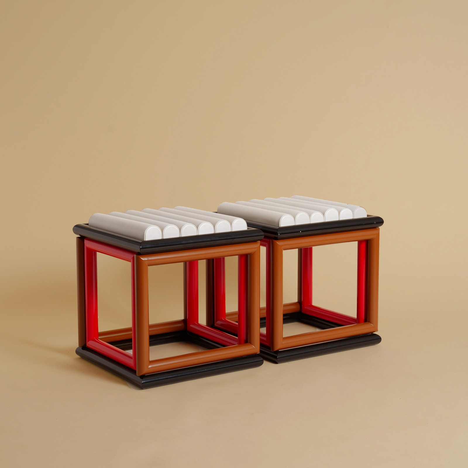 Jonathan Saunders (Scottish, b.1977) Pair of ?Renfrew? Stools: 2010s Leather, powder coated metal 46cm high x 45cm wide x 45cm deep Provenance: From a Distinguished Private International Collection