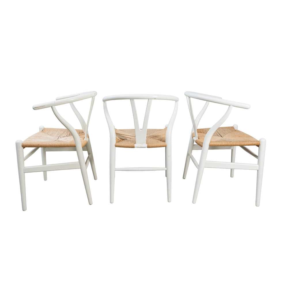 Hans J Wegner (Danish 1914-2007) for Carl Hansen & Son Set of five CH24 'Wishbone' Chairs: Originally designed 1949, this model later White painted oak, paper cord Metal manufacturer's label to underside of each example ?Carl Hansen & S?n Hans J. Wegner Made in Denmark? with serial number. 
