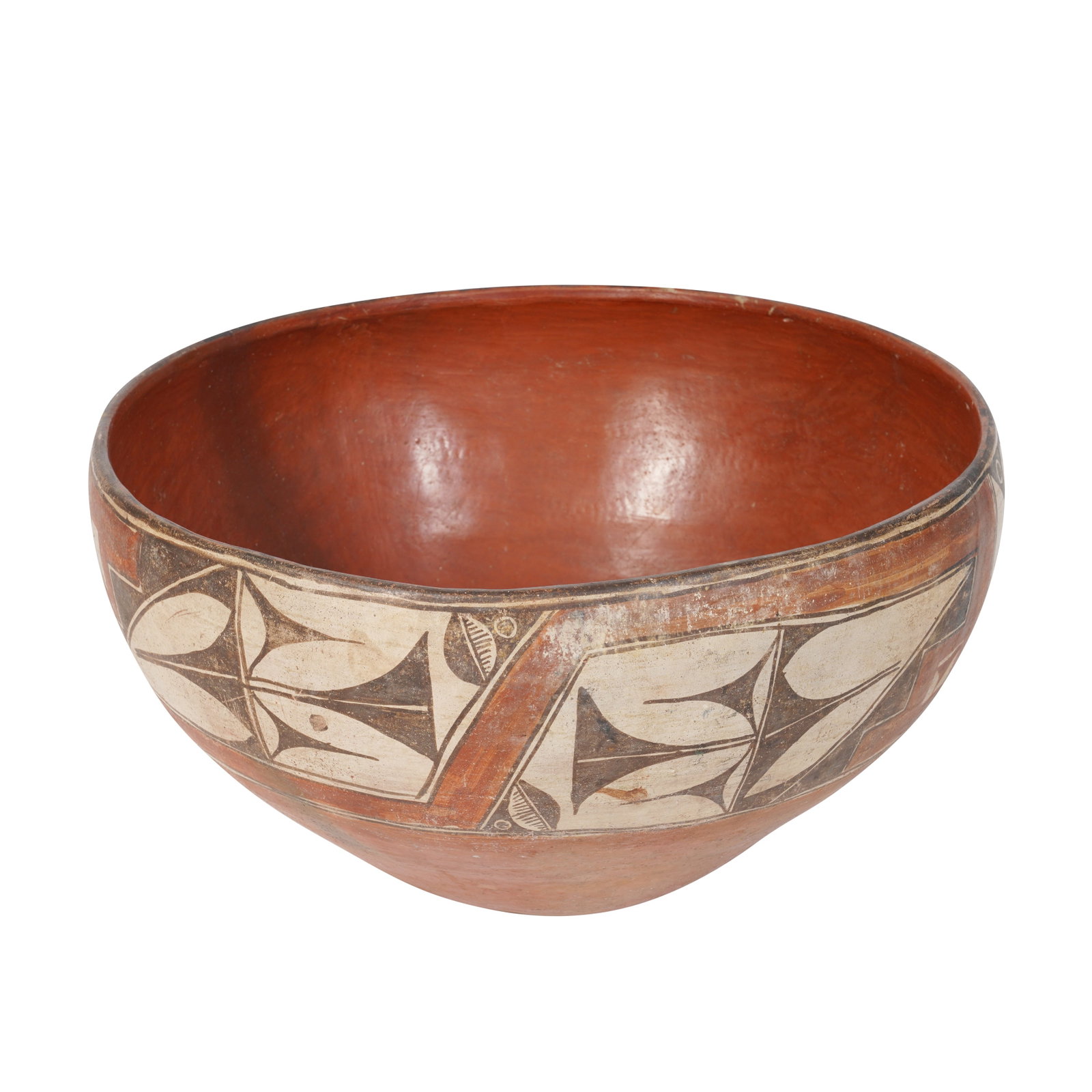 Native American Zia Pueblo community (American) Very large dough bowl with abstract floral black and: Circa 1890 Earthenware, black and white slip Unmarked 48cm diameter, 26cm high Notes: Ackland Art Museum, North Carolina, holds a very similar example