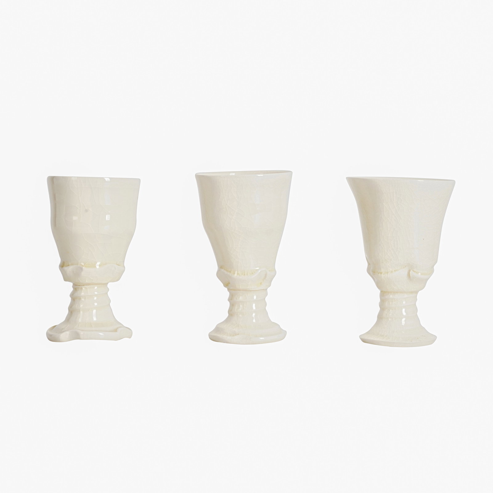 Takeshi Yasuda (Japanese b.1943) Three cream goblets with twist stems: 1998 Honey glazed earthenware Unmarked 13cm high (3) Provenance: Private collection Similar example held at the Victoria and Albert Museum, London Notes: This goblet is from a series made on the occas