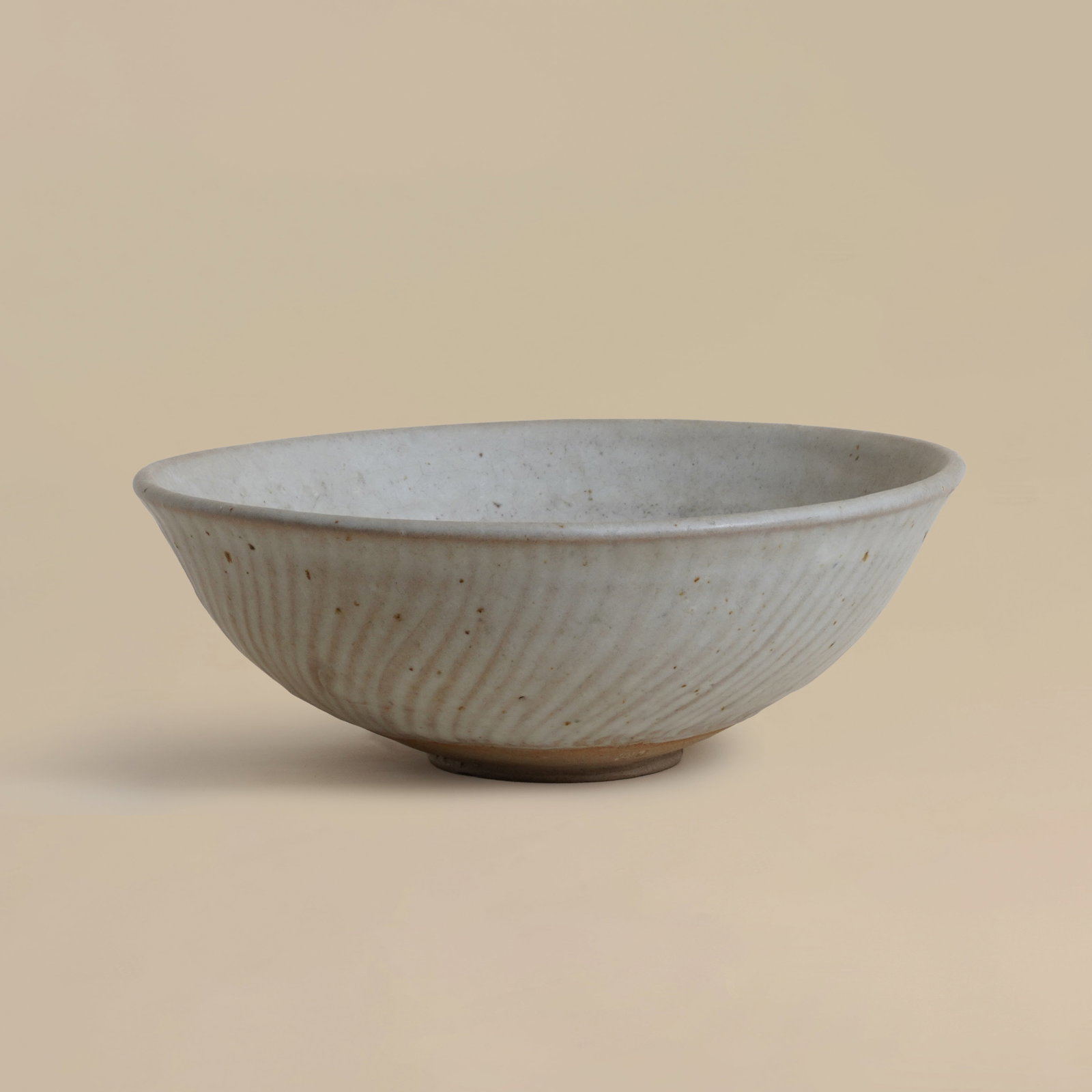 Katharine Pleydell-Bouverie (British 1895-1985) Large fruit bowl in soft white with speckles, (1 of 5)