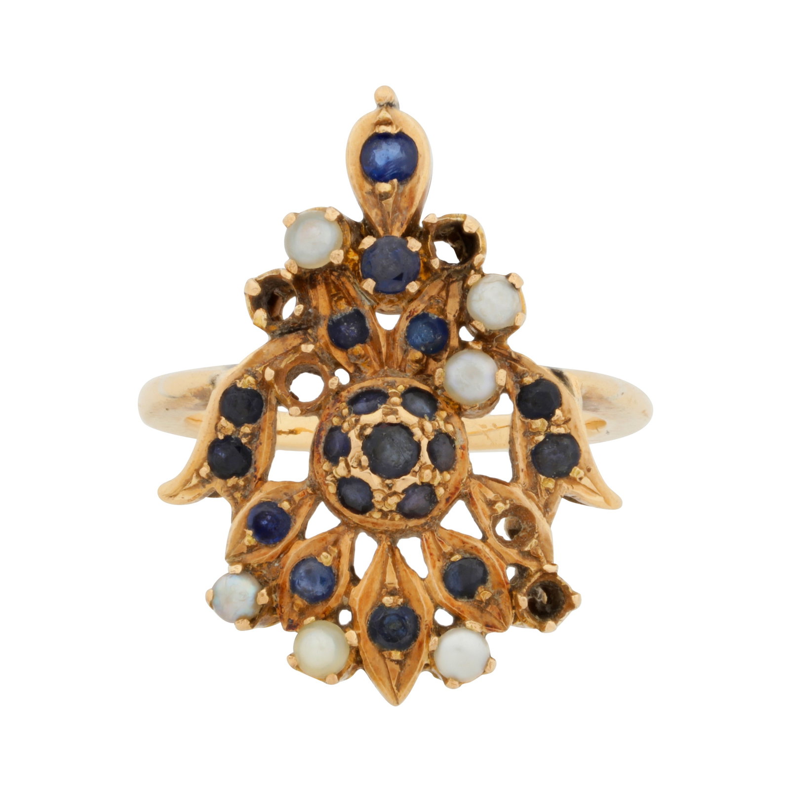 A sapphire and seed pearl ring: A sapphire and seed pearl ring Of palmette design, set with circular-cut sapphires, highlighted with seed pearls, mounted in yellow metal, unmarked, three pearls and one sapphire deficient, ring size