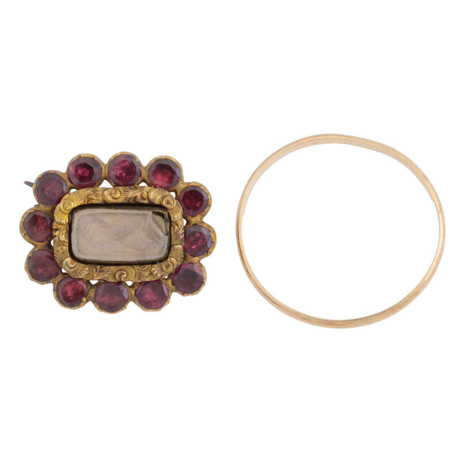 A ring and a brooch Yellow metal: A ring and a brooch Yellow metal To include a ring of polished design, 2.5mm width, unmarked, size V; together with a mourning brooch of rectangular shape, frame is engraved surrounding a glass