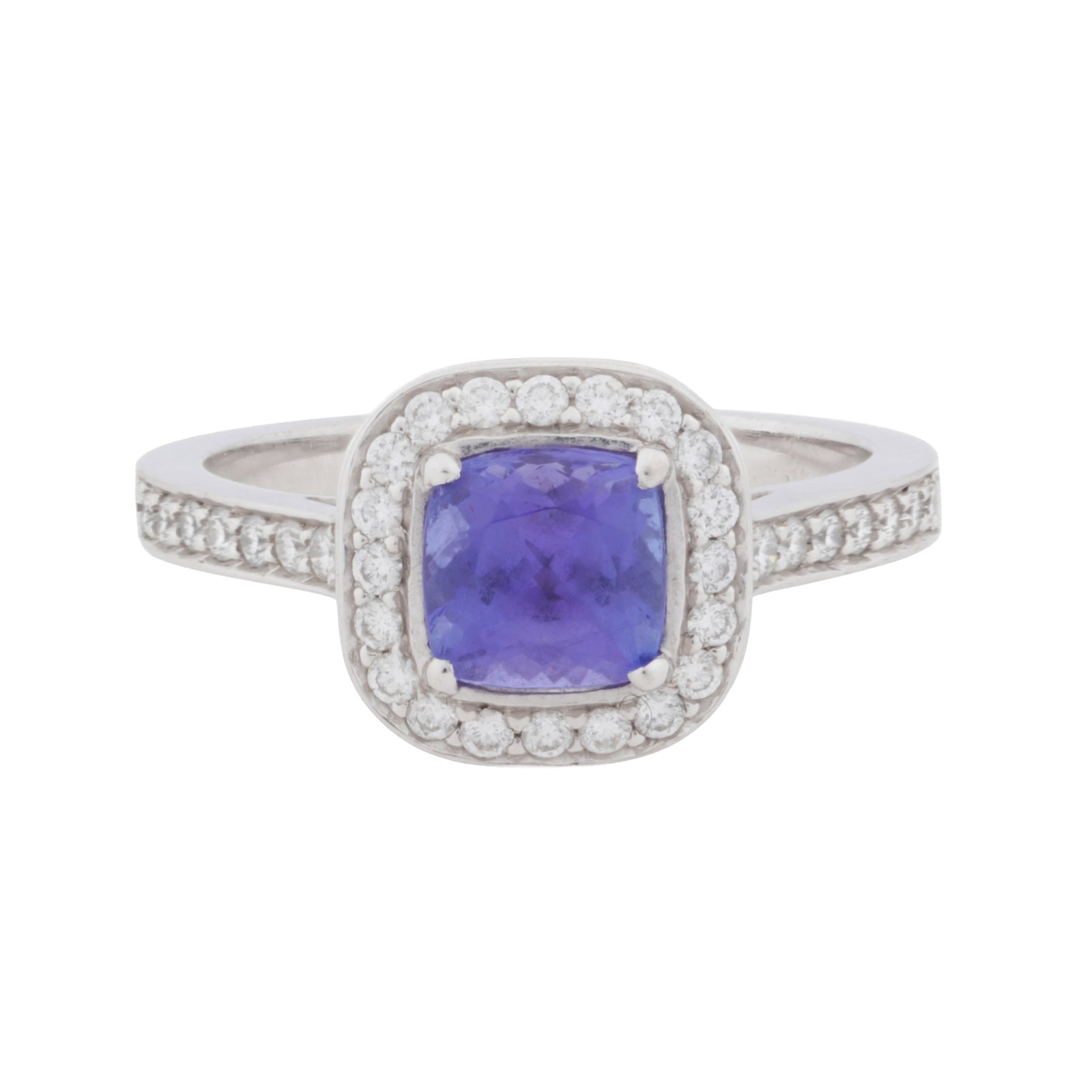 A diamond and tanzanite halo ring, circa 2011 18 carat white gold: A diamond and tanzanite halo ring, circa 2011 18 carat white gold Centrally claw-set with a cushion-cut tanzanite, surrounded by brilliant-cut diamonds, diamonds approx 0.30 carat total, maker's