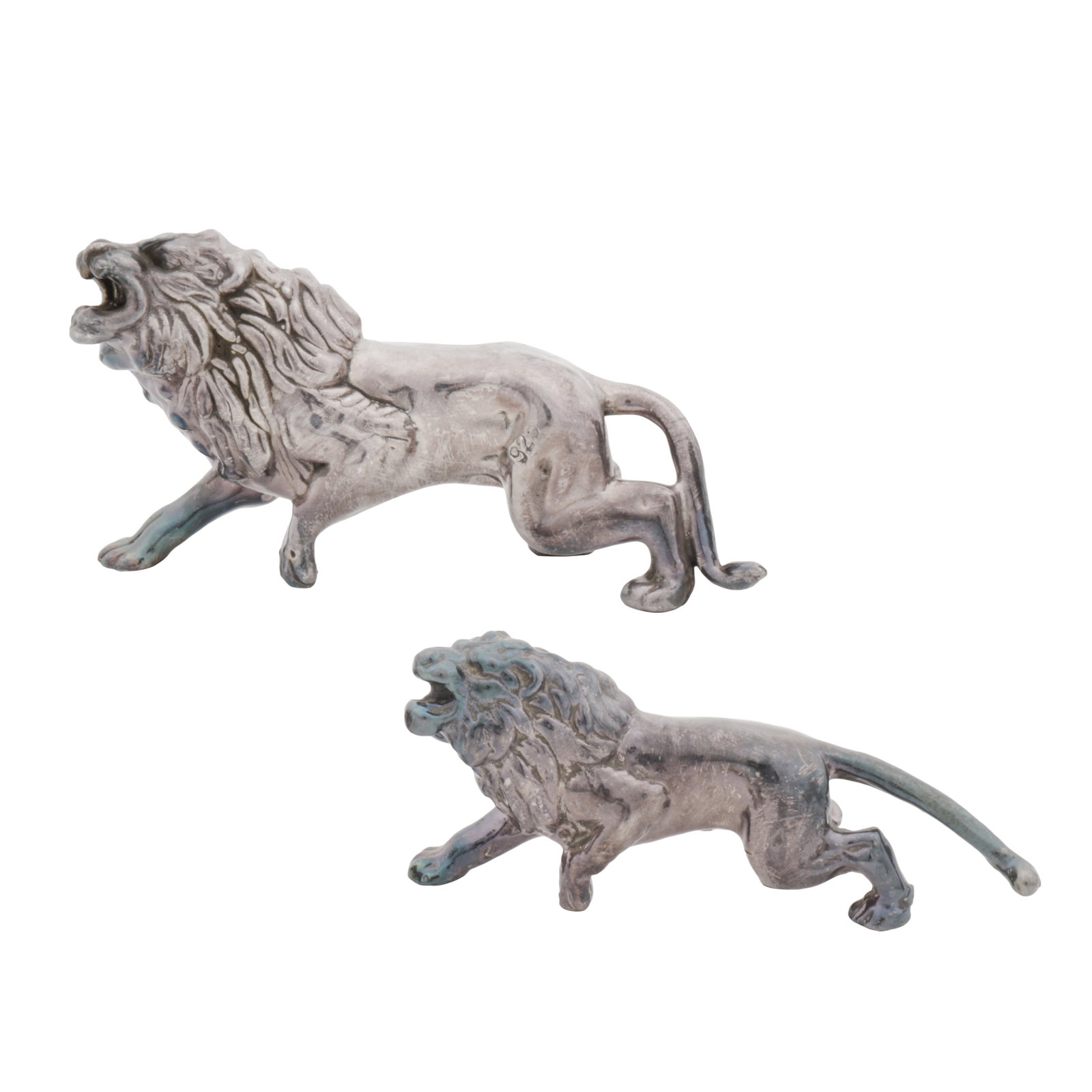 A pair of late 20th century possibly Italian sterling silver models of lions: A pair of late 20th century possibly Italian sterling silver models of lions Realistically modelled roaring as lions. Filled. Stamped only 925. Length - 7.2 cm / 2.83 inches