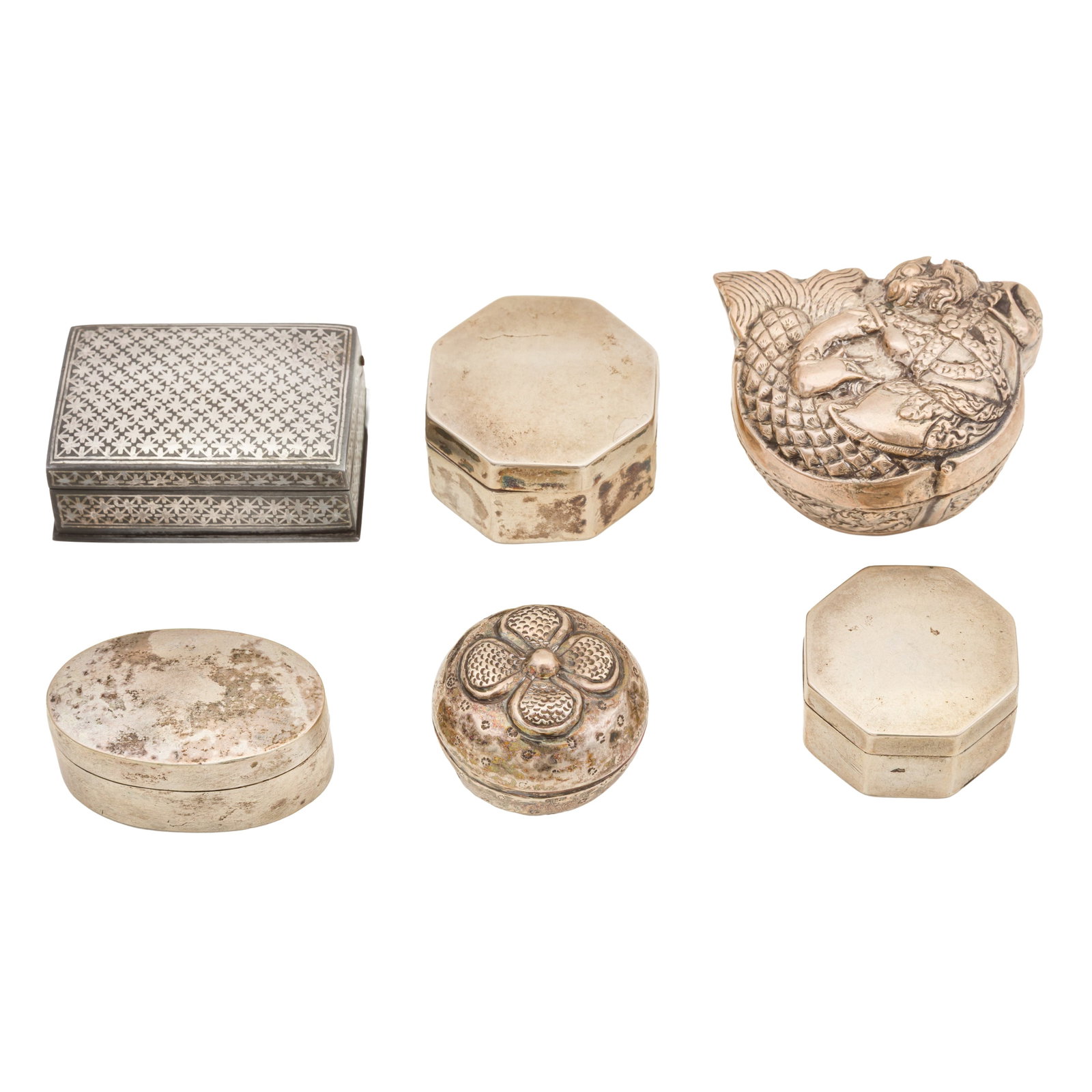 A mid-20th century Cambodian silver small box: A mid-20th century Cambodian silver small box Formed as Makardhwaj, together with two graduated octagonal boxes, the smaller marked in Chinese, a small rounded Cambodian box, an unmarked oval box.