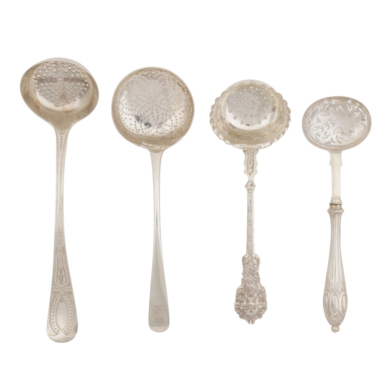 A Victorian sterling silver sugar sifter, Sheffield 1870 by Henry Wilkinson and Co: A Victorian sterling silver sugar sifter, Sheffield 1870 by Henry Wilkinson and Co Engraved decoration. Together with another by Charles Evans with Green Man mask terminal. A filled handle example by