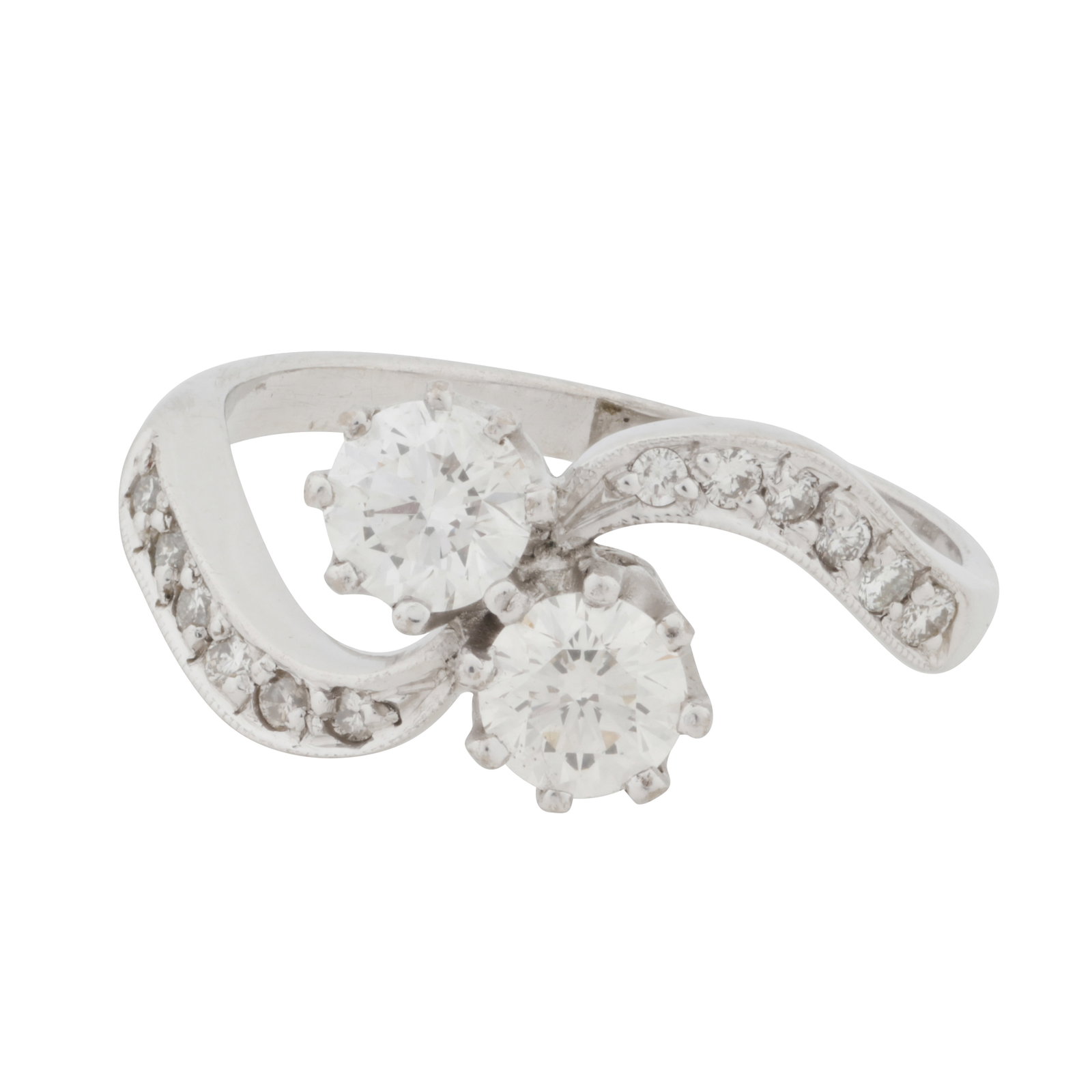 A toi et moi diamond ring White metal: A toi et moi diamond ring White metal Featuring two brilliant-cut diamonds diagonally-set weighing approximately 0.70 carat total, to similarly-cut diamond set shoulders of twisted design, mounted in
