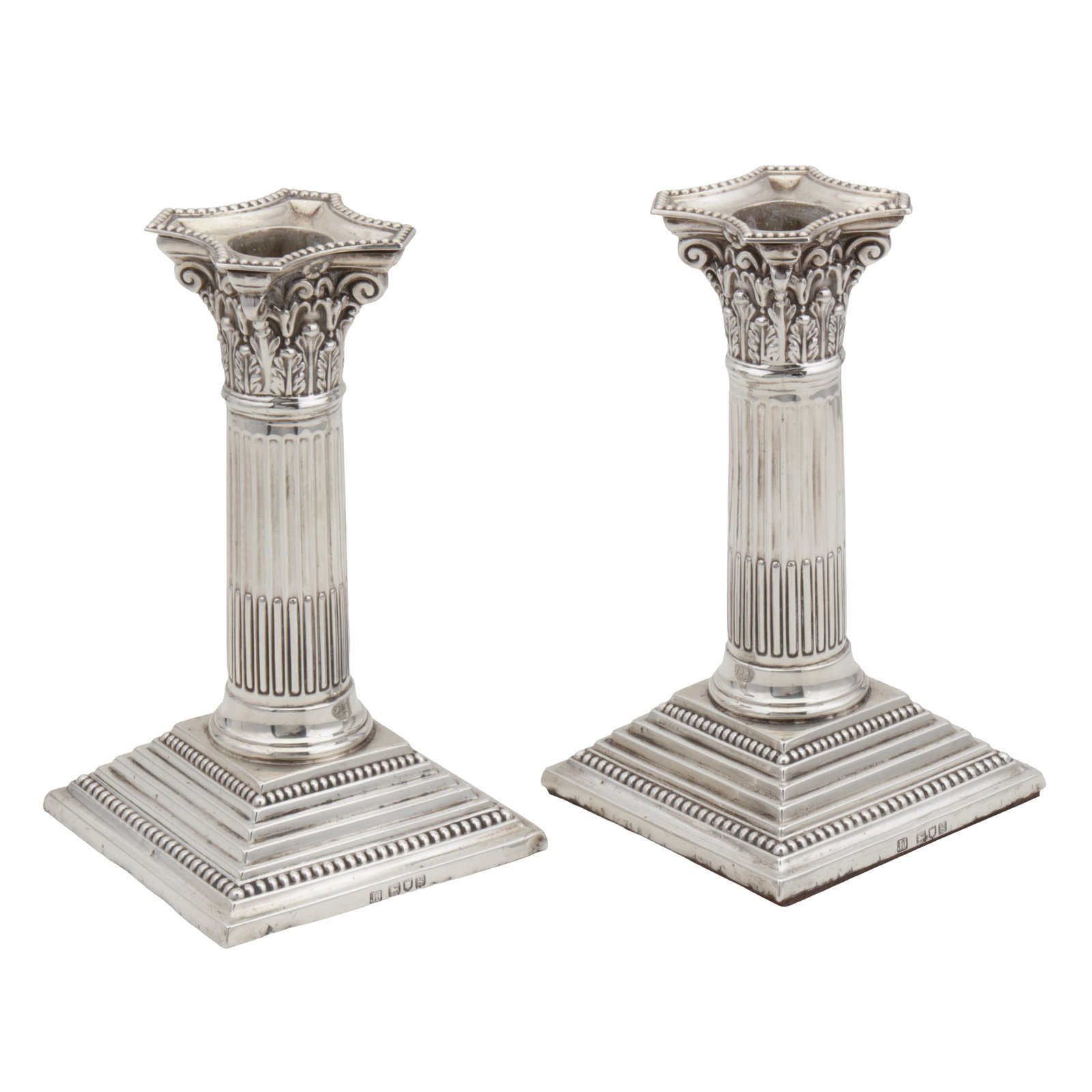 London 1902 by James Charles Jay A pair of Edwardian sterling silver dwarf or desk candlesticks: London 1902 by James Charles Jay A pair of Edwardian sterling silver dwarf or desk candlesticks Corinthian columns on stepped square base with beaded edges, removable shaped scones with beaded rims.