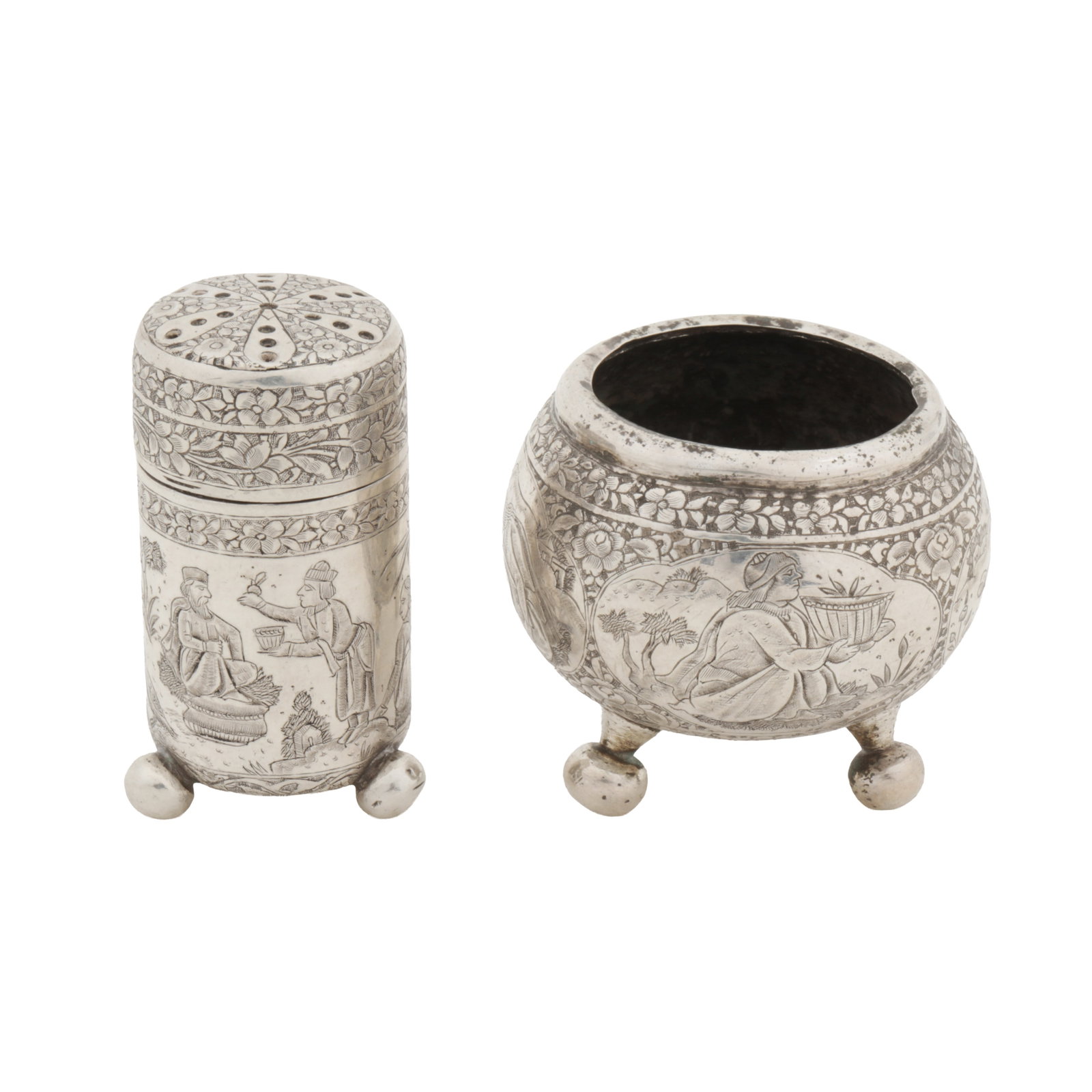 Isfahan circa 1920 An early 20th century Persian (Isfahan) unmarked silver salt and pepper pot: Isfahan circa 1920 An early 20th century Persian (Isfahan) unmarked silver salt and pepper pot Qajar dynasty. The salt of compressed circular form upon three feet, engraved ghalam zani decoration of
