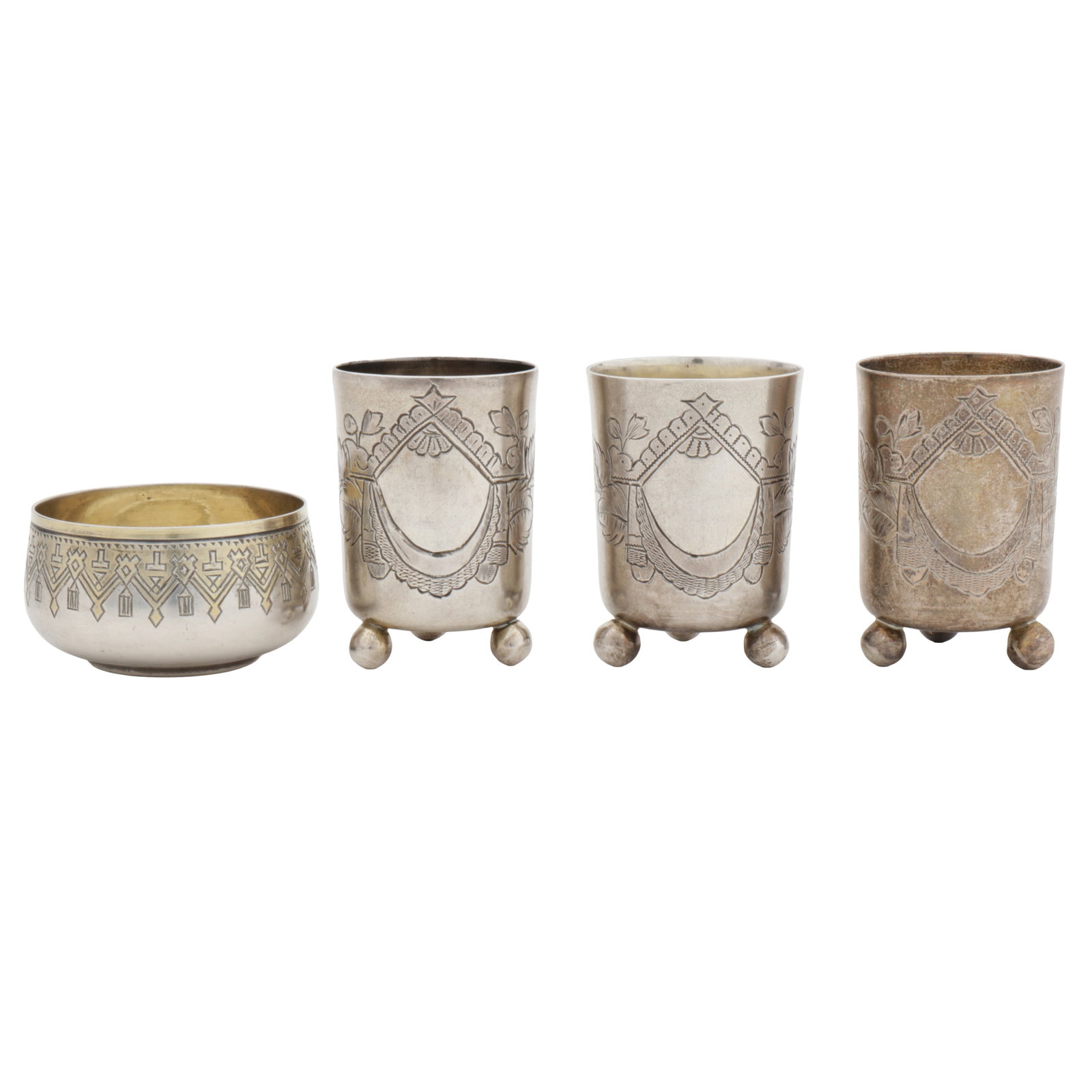 Moscow 1896 by BTC (unidentified) A set of three Nicholas II Russian 84 zolotnik (875 standard) silv: Moscow 1896 by BTC (unidentified) A set of three Nicholas II Russian 84 zolotnik (875 standard) silver vodka beakers Of cylindrical form, raised on three ball feet. Together with parcel gilt 84