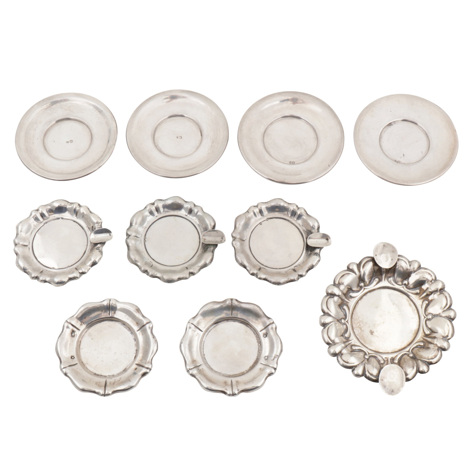 Vienna by Eduard Schnabel, circa 1920 An ealry 20th century set of four Austrian 800 standard silver: Vienna by Eduard Schnabel, circa 1920 An ealry 20th century set of four Austrian 800 standard silver saucers Of plain round form. Together with two flared rim saucers, Budapest circa 1930, and three