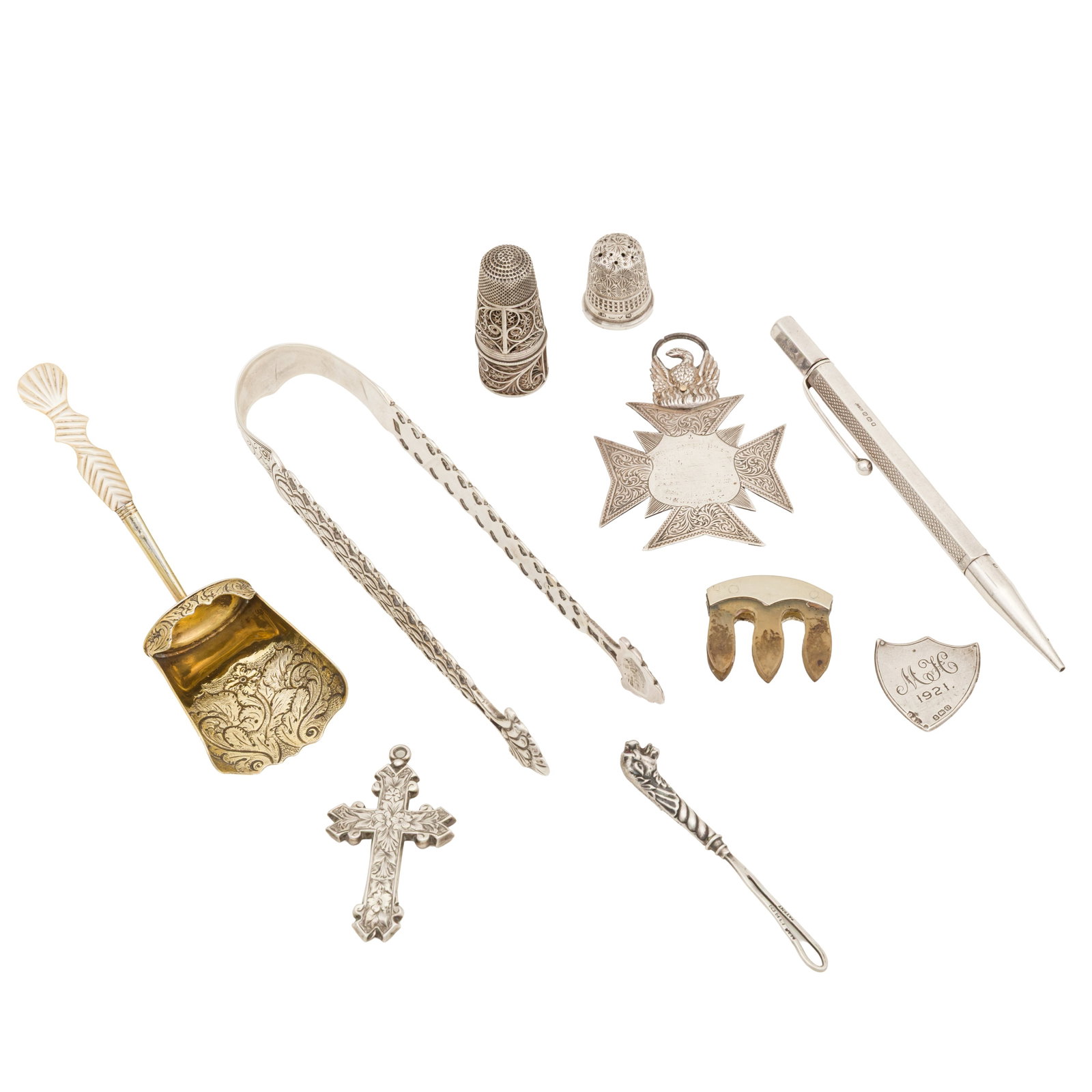 London 1823 by Robert Mitchell or Rebecca Merfield A George IV sterling silver gilt caddy spoon: London 1823 by Robert Mitchell or Rebecca Merfield A George IV sterling silver gilt caddy spoon Shovel form with chased foliate decoration, mother of pearl handle. Together with a pari of George III