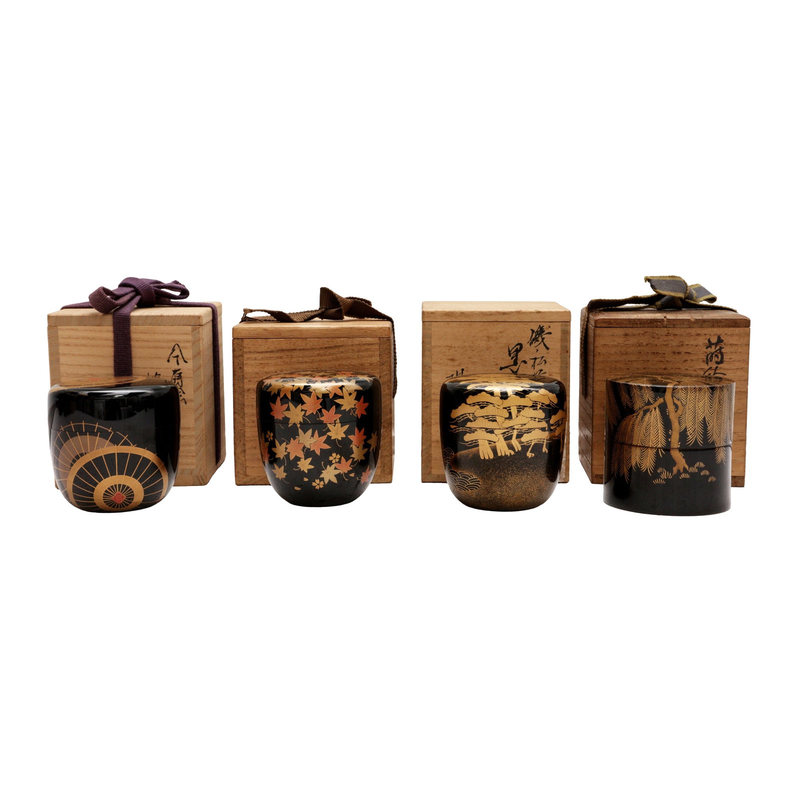 A group of four Japanese lacquer and maki-e natsume tea caddies, 20th century: Comprising four lacquer and maki-e natsume tea caddies together with tomobako wood boxes and covers, inscribed and sealed by the artists Size:(various sizes) Qty: (4) Provenance: Private collection, O