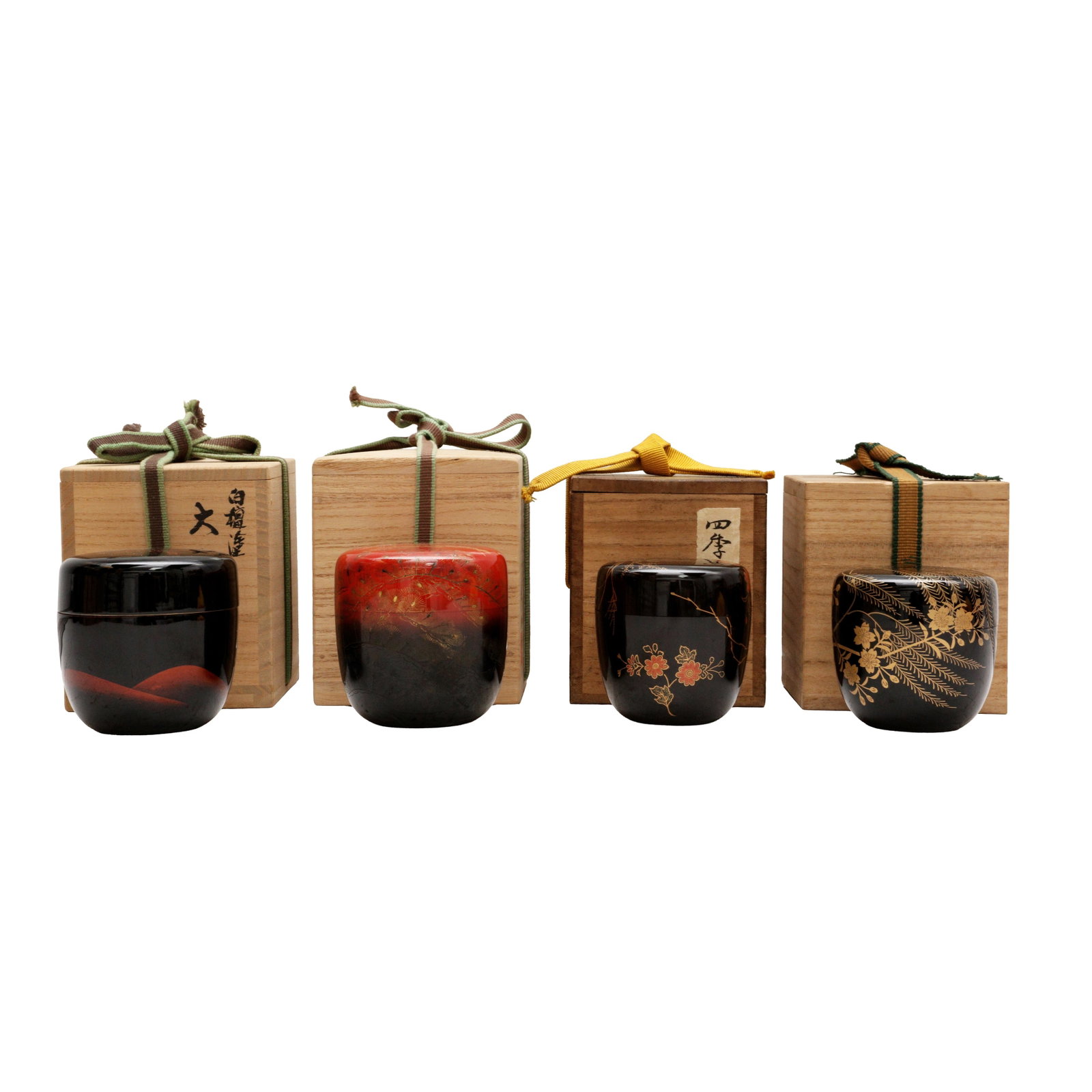 A group of four Japanese lacquer and maki-e natsume tea caddies, 20th century: Comprising four lacquer and maki-e natsume tea caddies together with tomobako wood boxes and covers, inscribed and sealed by the artists Size:(various sizes) Qty: (4) Provenance: Private collection, O