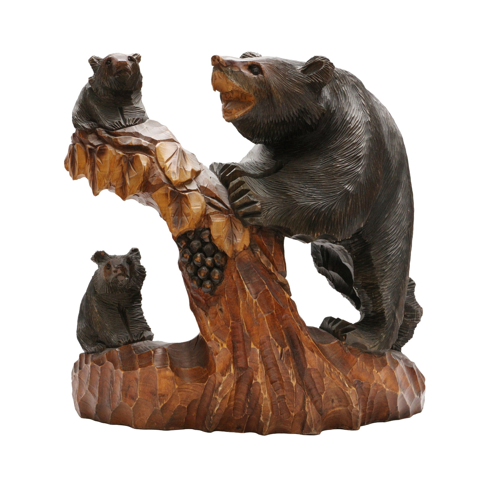 A Japanese Ainu wood 'Kibori Kuma' bear sculpture, Hokkaido, 20th century: The robustly carved wood figure in the form of a large bear leaning against a trunk and surrounded by two cubs Size:(40.5cm high) Qty: (1) Provenance: Private collection, bought in Japan between 1992 