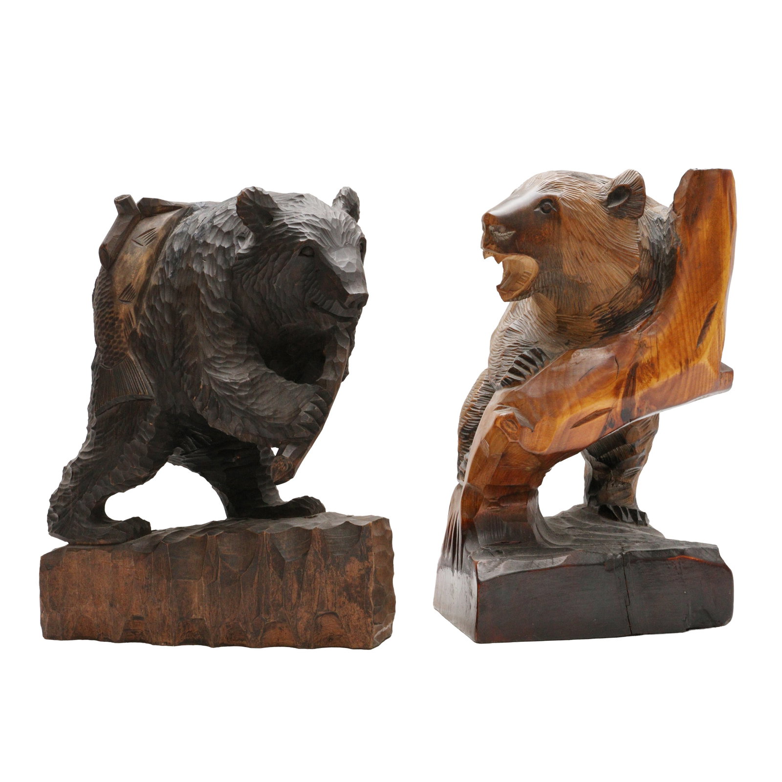 Two Japanese Ainu wood 'Kibori Kuma' bear sculptures, Hokkaido, 20th century: Two robustly carved wood figures in the form of a large bears, one leaning on a trunk and the othe standing Size:(31.7cm highest) Qty: (2) Provenance: Private collection, bought in Japan between 1992 