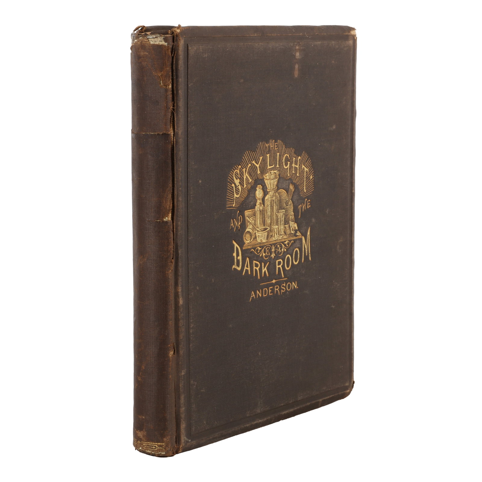 Elbert Anderson (XIX) The Skylight and the Darkroom: A Complete Text-book on Portrait Photography,: First Edition, hardback with brown cloth board, gilt title and illustration, 12 photographic plates tipped-in to five sheets, some cracking and minor losses to spine. Philadelphia: Benerman & Wilson, 