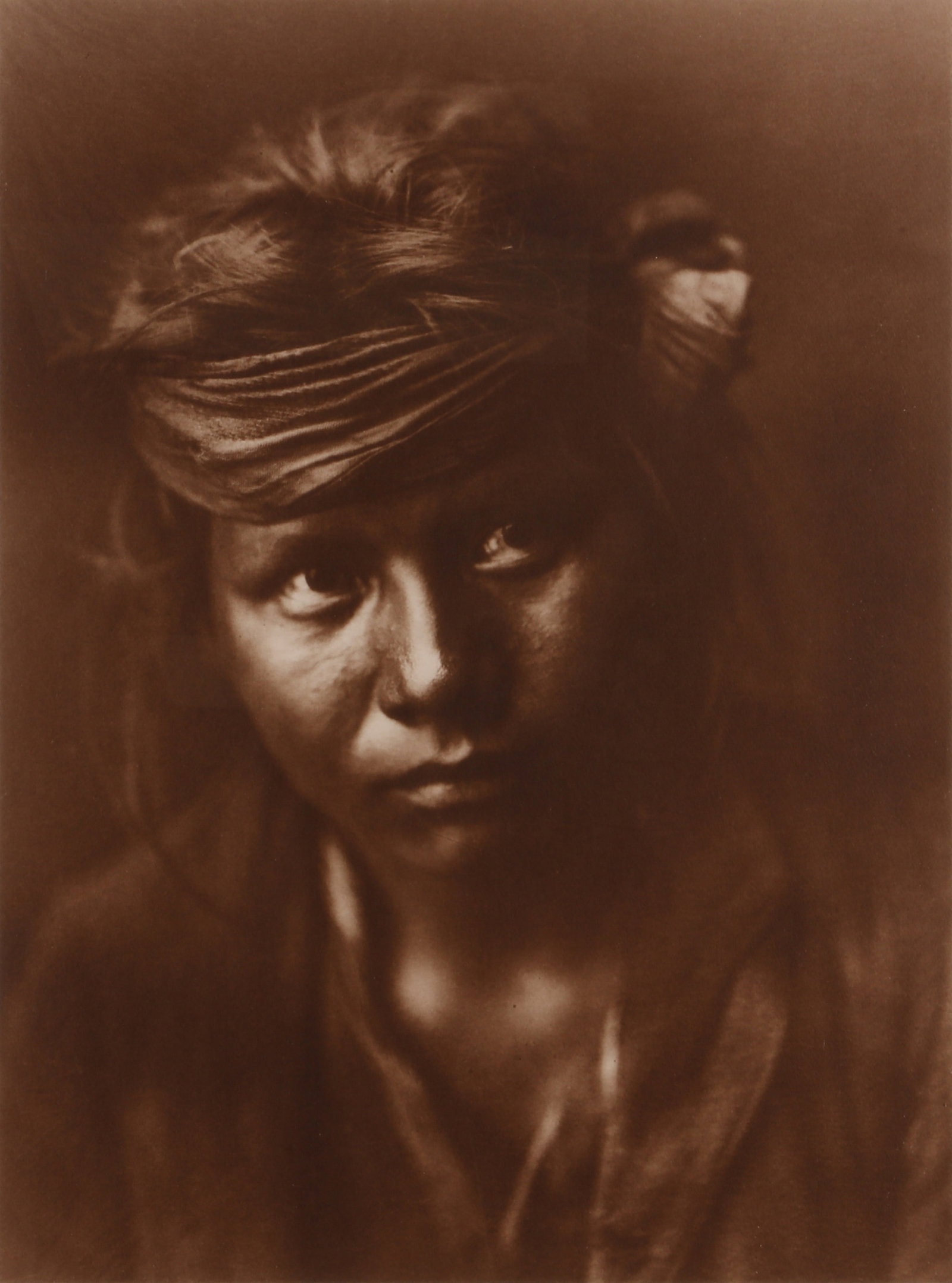 Edward S. Curtis (1868-1952) & Jean-Antony du Lac (1929-2002) A Son of the Desert, 1899: Orotone, printed 1979 by Jean-Anthony du Lac, image size 44.5 x 33cm, signed, titled, and dated by the printer in pencil lower margin recto. Framed, frame size 68.2 x 53cm. Qty: (1)