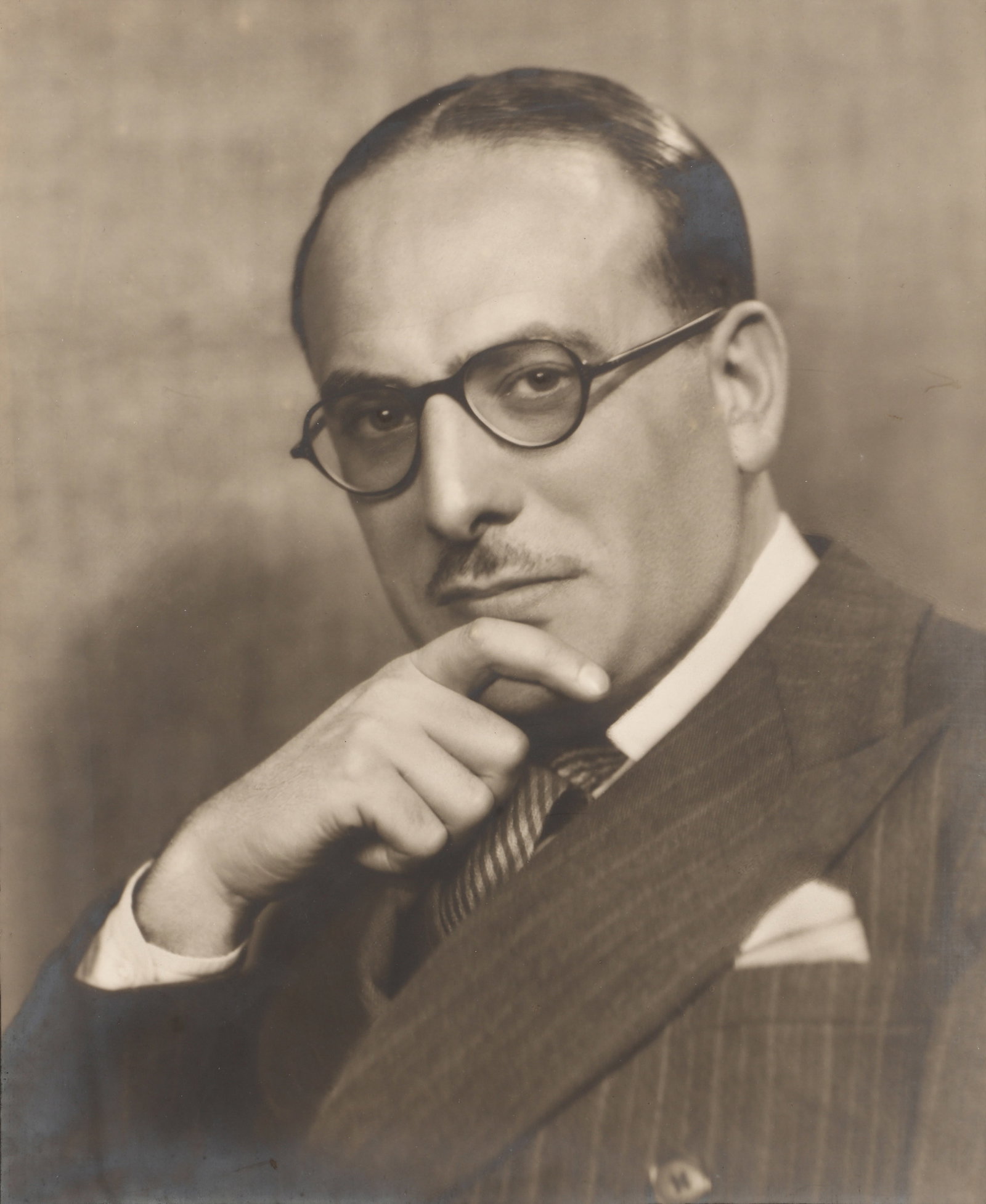 Dorothy Wilding (1893-1976) Studio Portrait of Michael Balcon, 1937: Vintage silver bromide print on Wilding's combination tissue and card mount, image size 29 x 24cm, signed by the photographer in pencil on tissue lower left margin, with Wilding's Camera Portraits Old