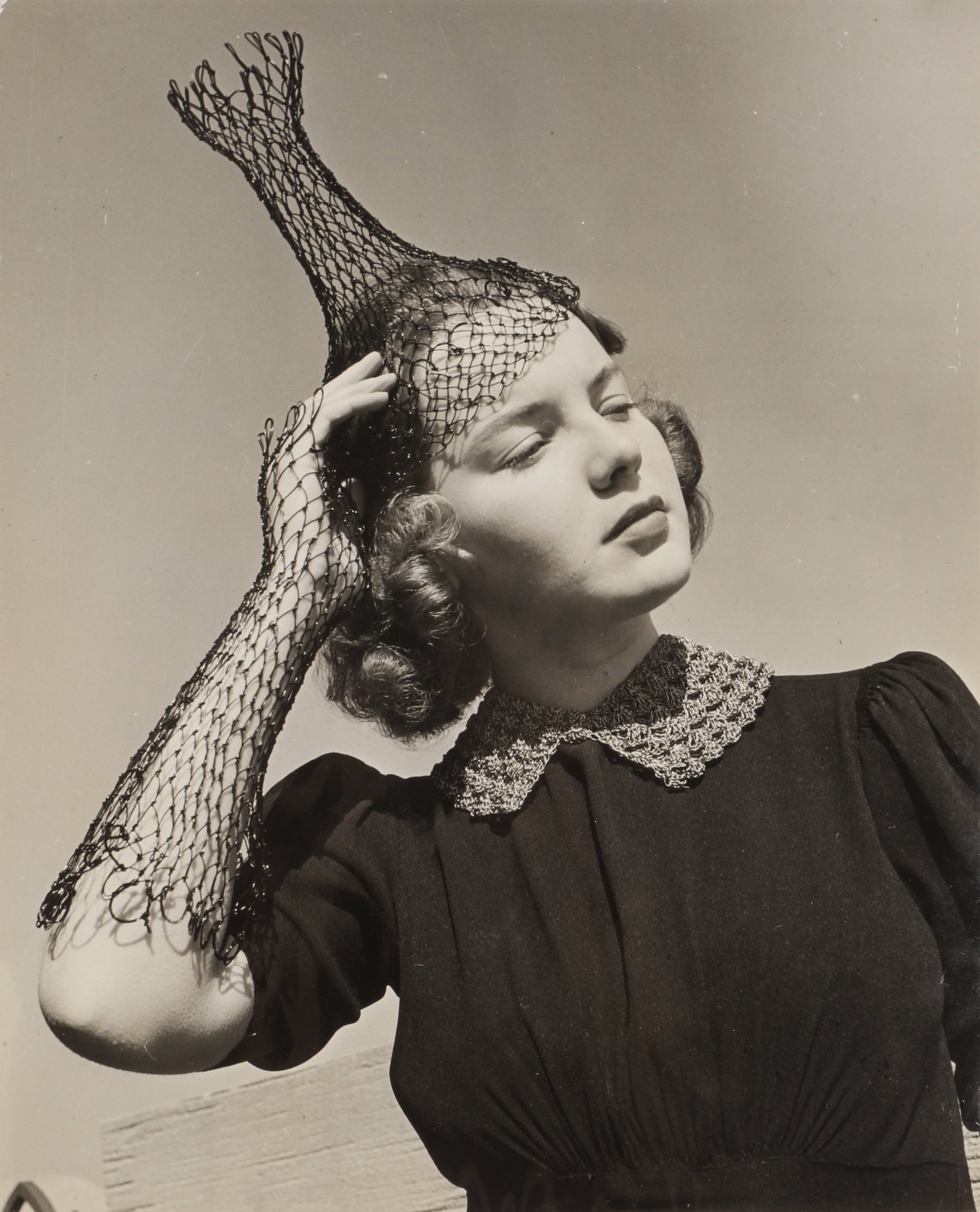 Alfred Eisenstaedt (1898-1995) Fishnets Catch Fashion Fancy, 1939: Vintage silver gelatin press print, image/sheet size 24.5 x 19.8, various stamps verso, including Picture Post / 3 JUN 1939, Eisenstaedt's PIX Publishing credit stap, and Made in USA, among other anno