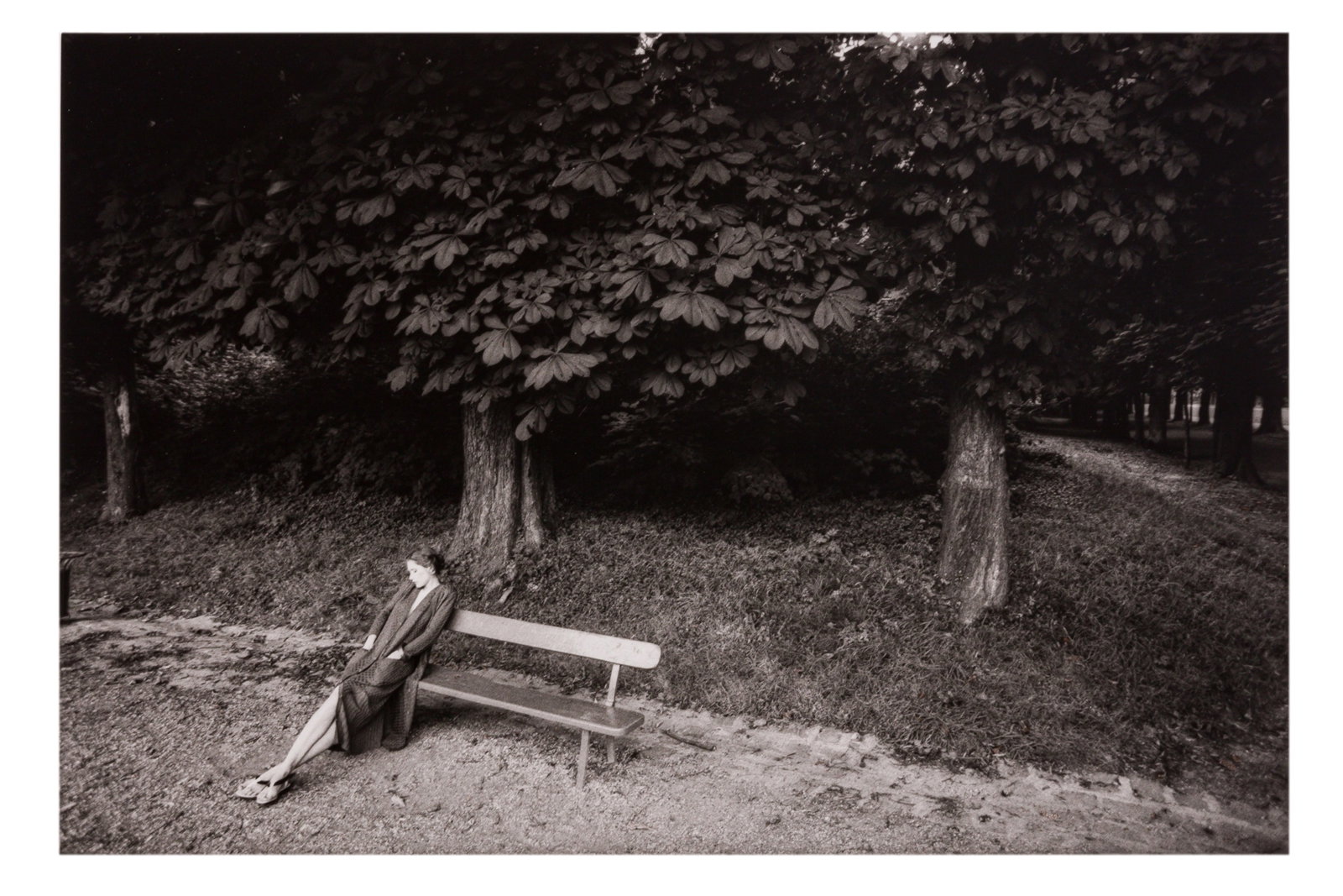 Jeanloup Sieff (1933-2000) Femme Sur un Banc, 1981: Vintage silver gelatin print, image size 20 x 30cm, sheet size 30.5 x 40.5cm, signed and titled by the photographer in pencil verso, with Sieff's credit stamp verso.