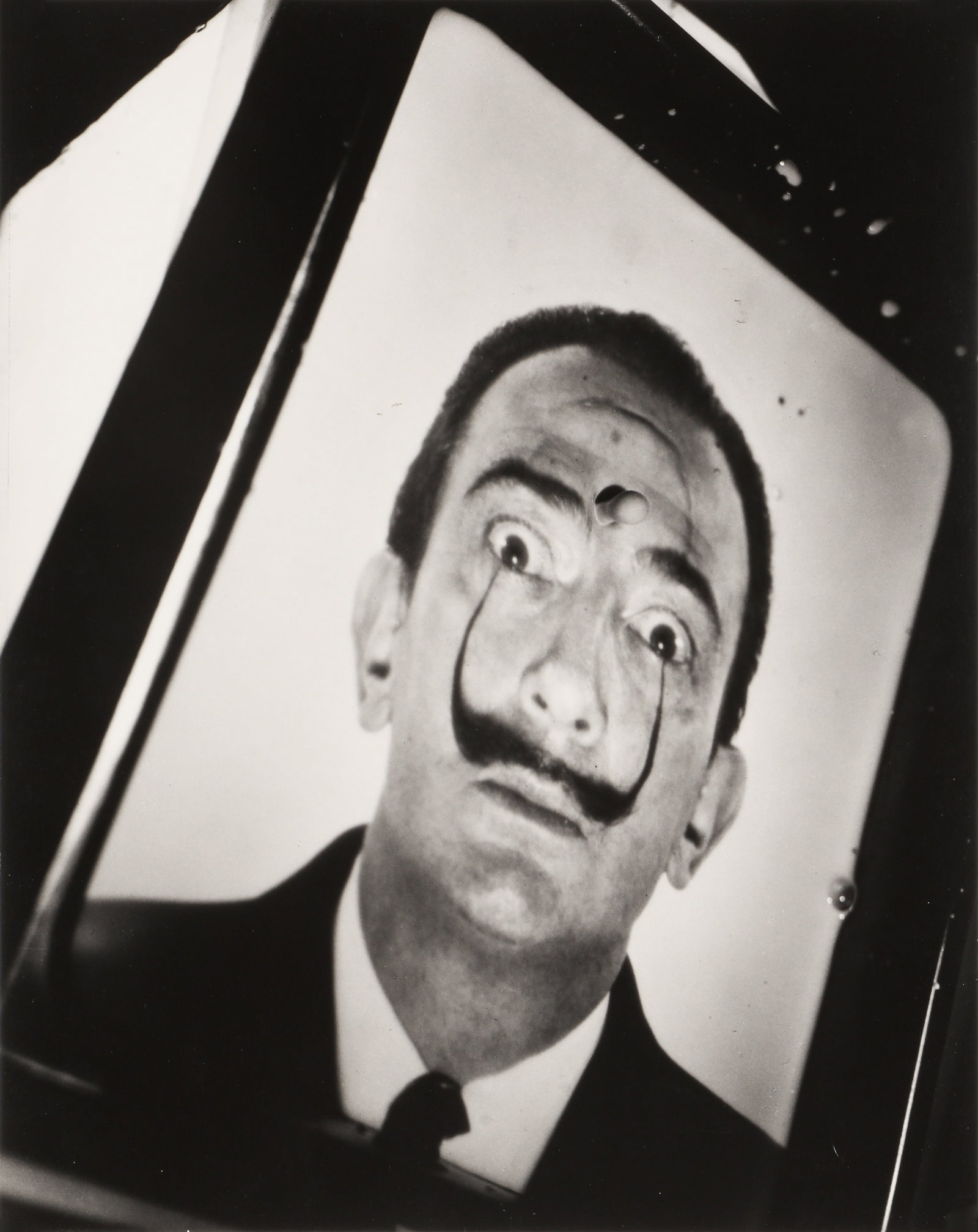 Philippe Halsman (1906-1979) Salvador Dali [Exploding Face / With Milk], 1953: Silver gelatin print, printed later, image/sheet size 35 x 27.7cm, with Halsman's copyright stamp verso. "Philippe's long collaboration with Dali produced many memorable photographs. This time, in 195