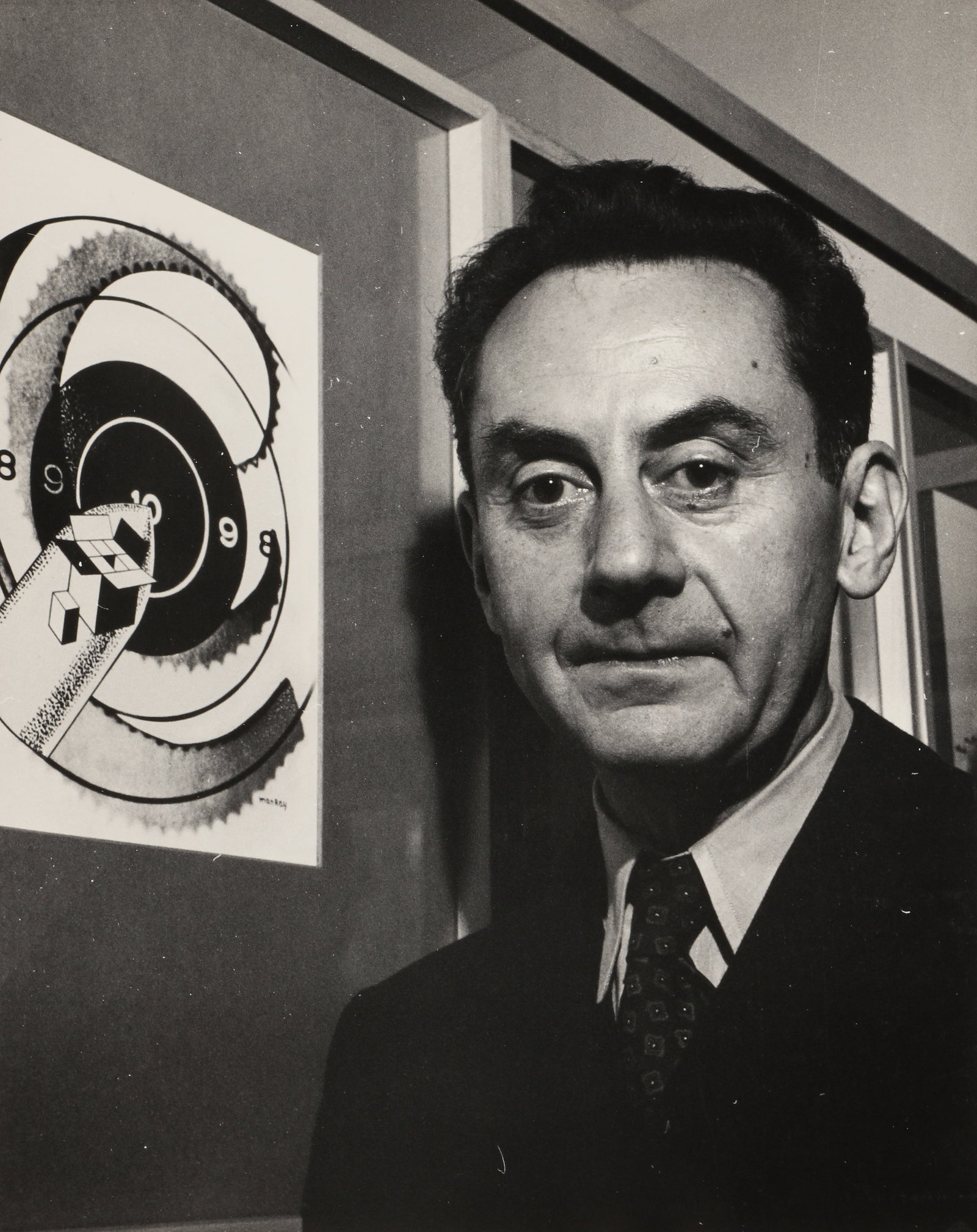 Gordon Coster (1906-1988) Man Ray, "Modern Art in Advertising", Art Institute of Chicago, 1945: Silver gelatin print, image size 33.7 x 26.7cm, sheet size 35.3 x 28cm, with the photographer's credit stamp verso. Man Ray was present at the "Modern Art in Advertising" opening at the Art Institute 