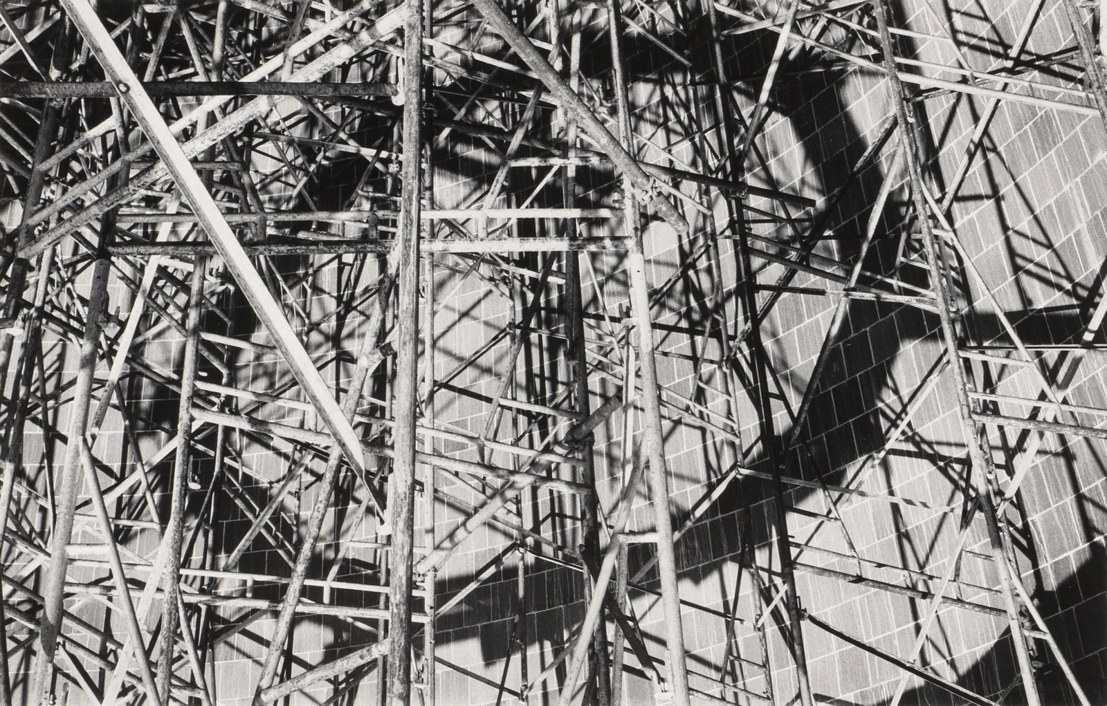 Burk Uzzle (b.1938) Untitled [Scaffolding], 1978: Vintage silver gelatin print, image size 18.5 x 28.2cm, sheet size 27.5 x 35cm, signed by the photographer in pencil verso.