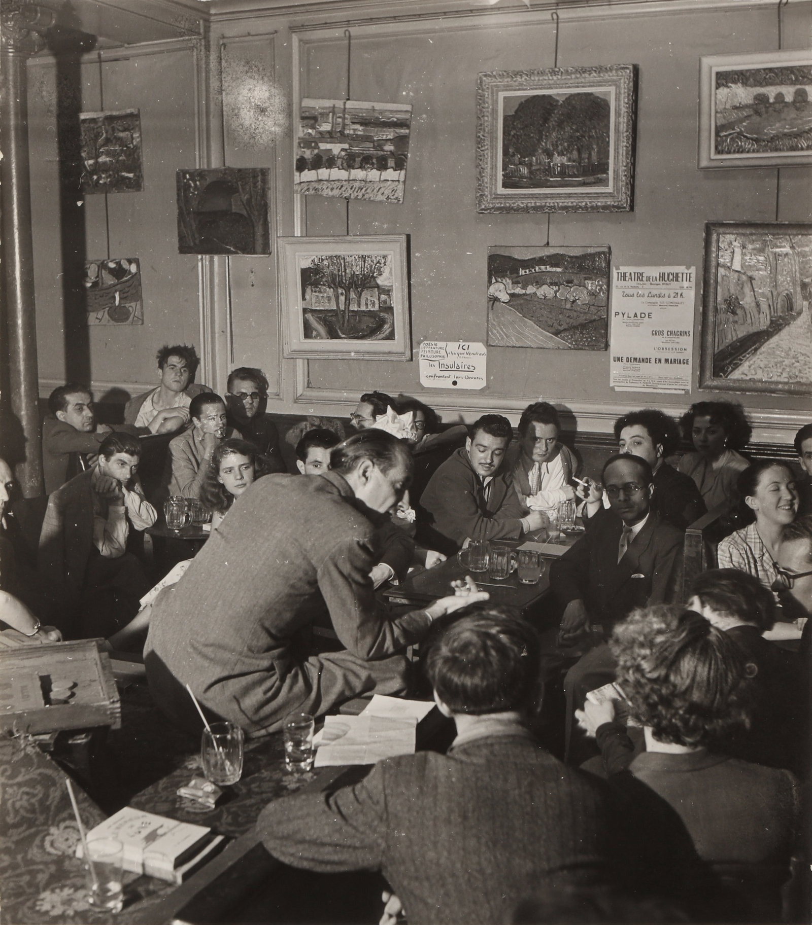 Robert Doisneau (1912-1994) Untitled (Les Insulaires), c. 1950s: Vintage silver gelatin print, image size: 20.5 x 18 cm, sheet size: 24 x 18 cm, annotated in unknown hand in pencil with "Photo Robert Doisneau" and "Collection Robert Guiraud" stamps verso.