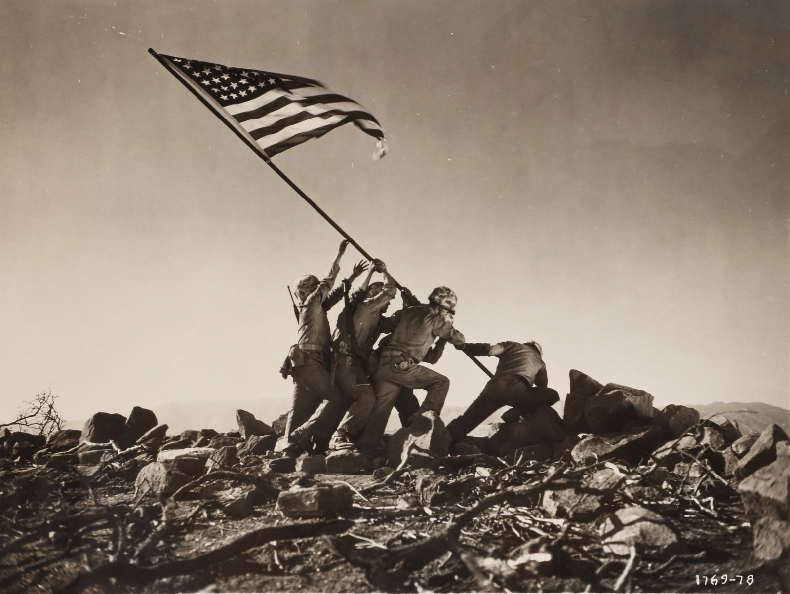 Unknown Photographer Raising the Flag, 1949: Vintage silver gelatin press print, image: 17.5 x 23.2cm, sheet size: 20.2 x 25.5cm, titled and annotated in pencil and crayon in various hands verso. Note: Most probably taken on the set of Sands of 