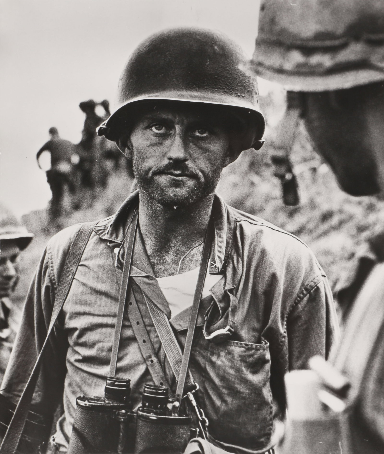 David Douglas Duncan (1916-2018) Marine Capt. Ike Fenton, Nakdong River Perimeter, No-Name Ridge,: Silver gelatin press print, printed later from a MoMA copy negative, image size 23 x 19.4cm, sheet size 25.3 x 20.5cm, with Family of Man exhibition caption credit verso. "Exhibition No. 453 / Korea. 