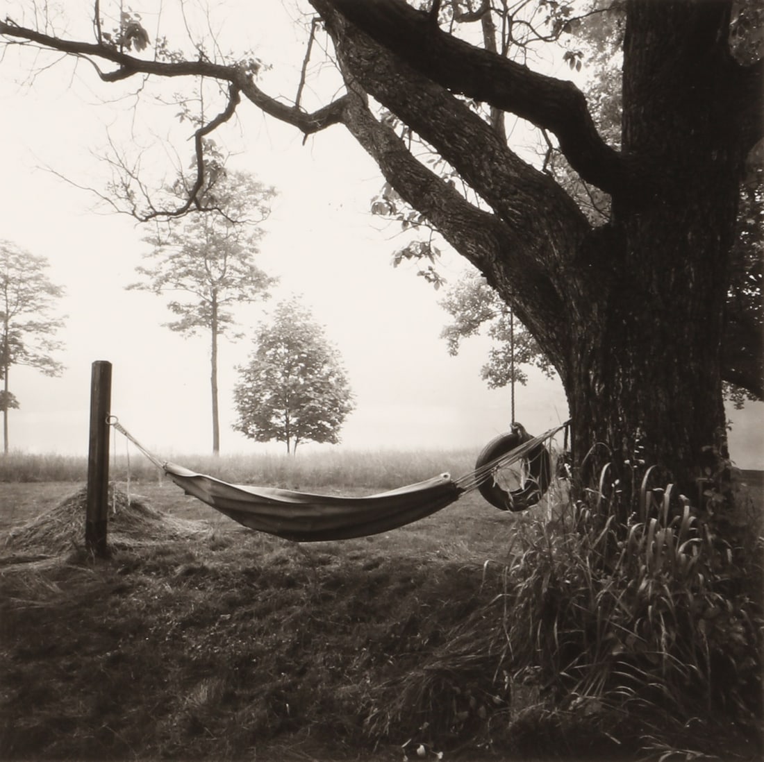Lynn Swigart (b.1930) Hammock, c.1988: Vintage silver gelatin print, image size 10 x 10cm, sheet size 22.3 x 15.2, with Swigart's copyright stamp verso. Housed in an envelope inscribed and dated by Lynn Swigart. *This lot is offered withou