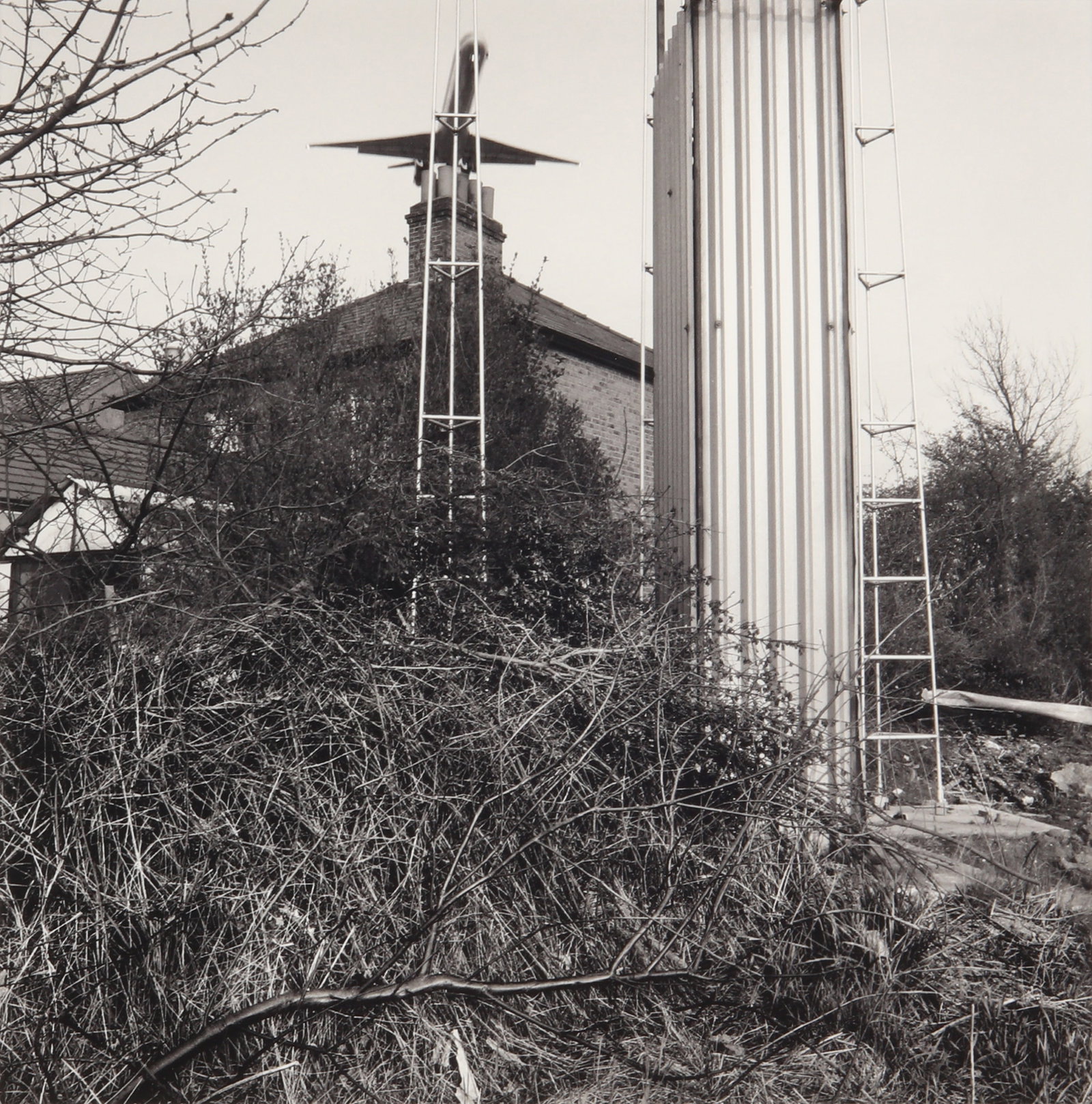 Brian Griffin (1948-2024) Hatton Cross, London, 1983: Archival pigment print, printed later, image size 16.3 x 16.3cm, annotated in pencil on the lower margin of the overmount. Framed, frame size 32 x 27cm. Accompanied by the auction catalogue 'Brian Gri