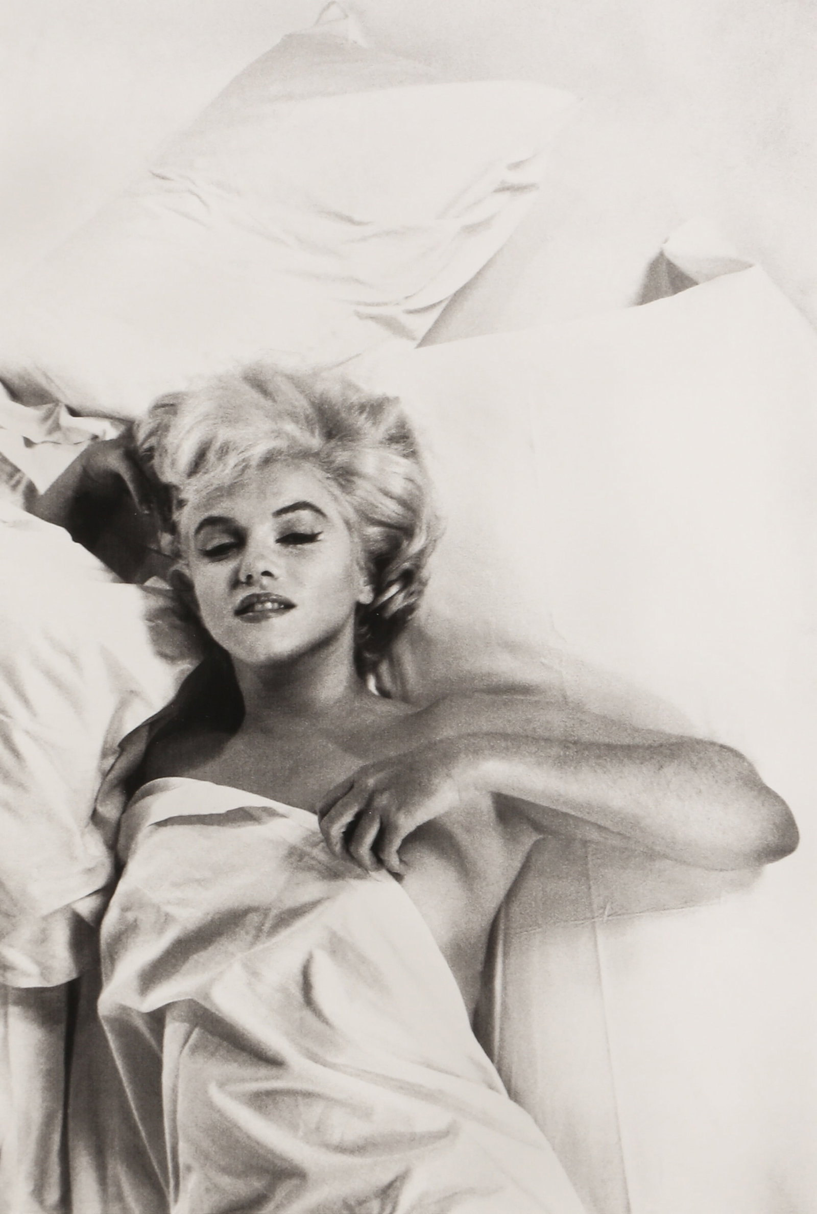 Eve Arnold (1912-2012) Marilyn Monroe Rests In Between Takes on the Set of The Misfits, 1960: Giclee print, printed later, image size 45 x 31cm, with Arnold's facsimile signature and edition 400/495 lower margin recto. Framed, frame size 75 x 58.5cm. Qty: (1)