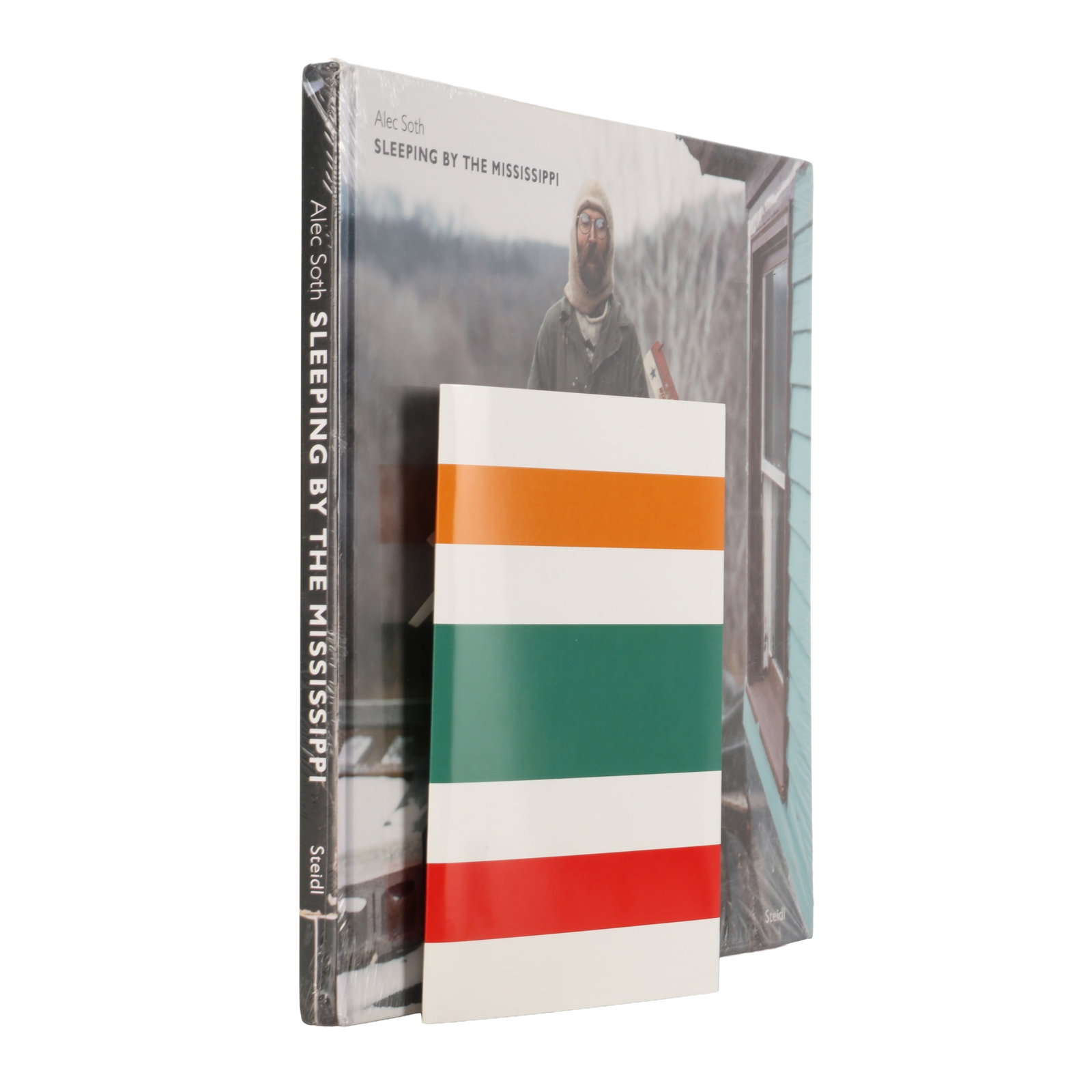 Alec Soth (b.1969) Sleeping By The Mississippi, 2004; Seven Eleven 7/11, 2015: Sleeping by the Mississippi, First Hardcover Edition, original photographic cloth, oblong quarto, in original shrinkwrap. Gottingen: Steidl, 2004. 7-Eleven 7/11, softcover, unpaginated. St. Paul: Litt