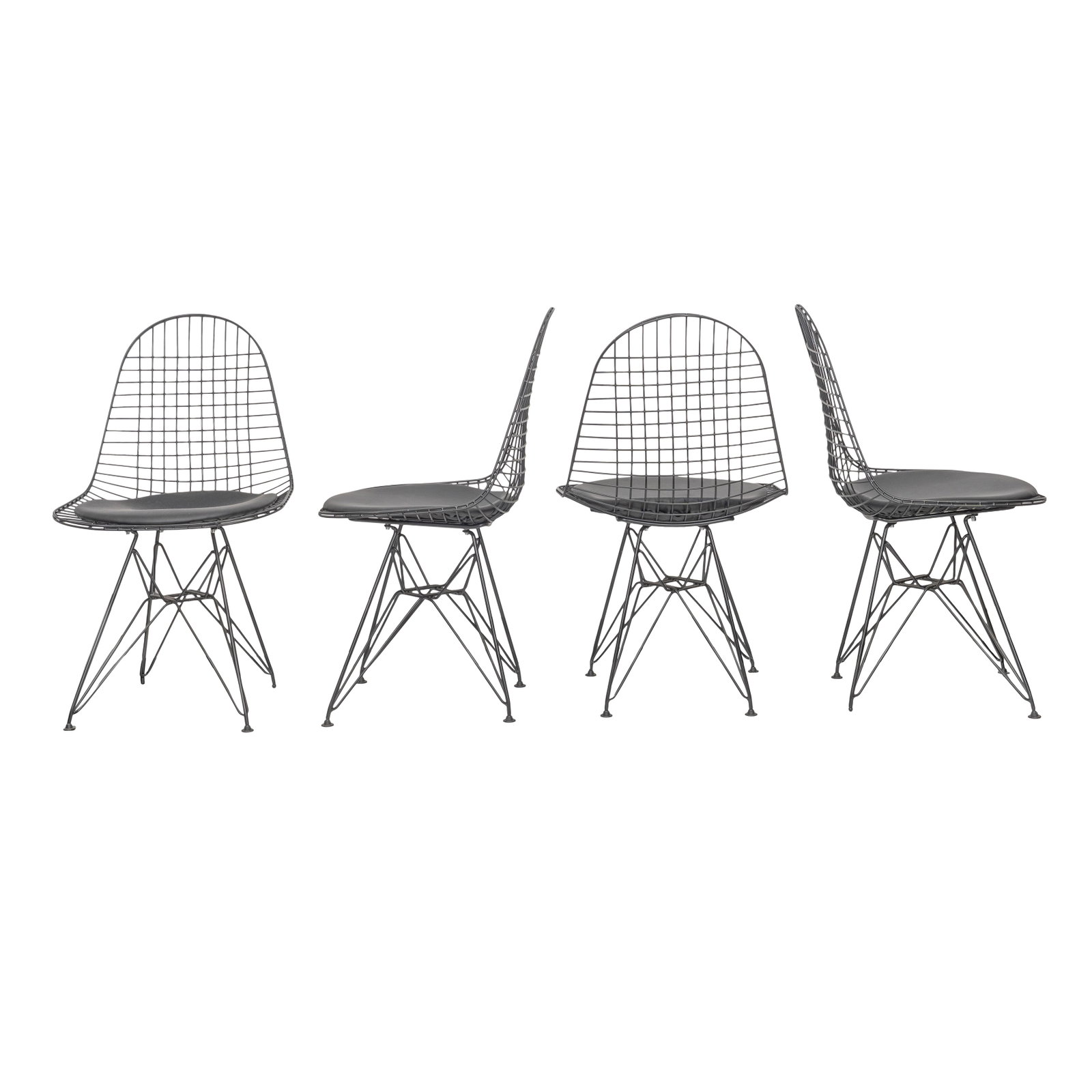 After Charles (American 1907-1988) and Ray Eames (American 1912-1988) Set of 7 Eiffel-style chairs: Contemporary Coated metal, faux leather Unmarked 85cm high x 49cm wide x 42cm deep Qty: (2)