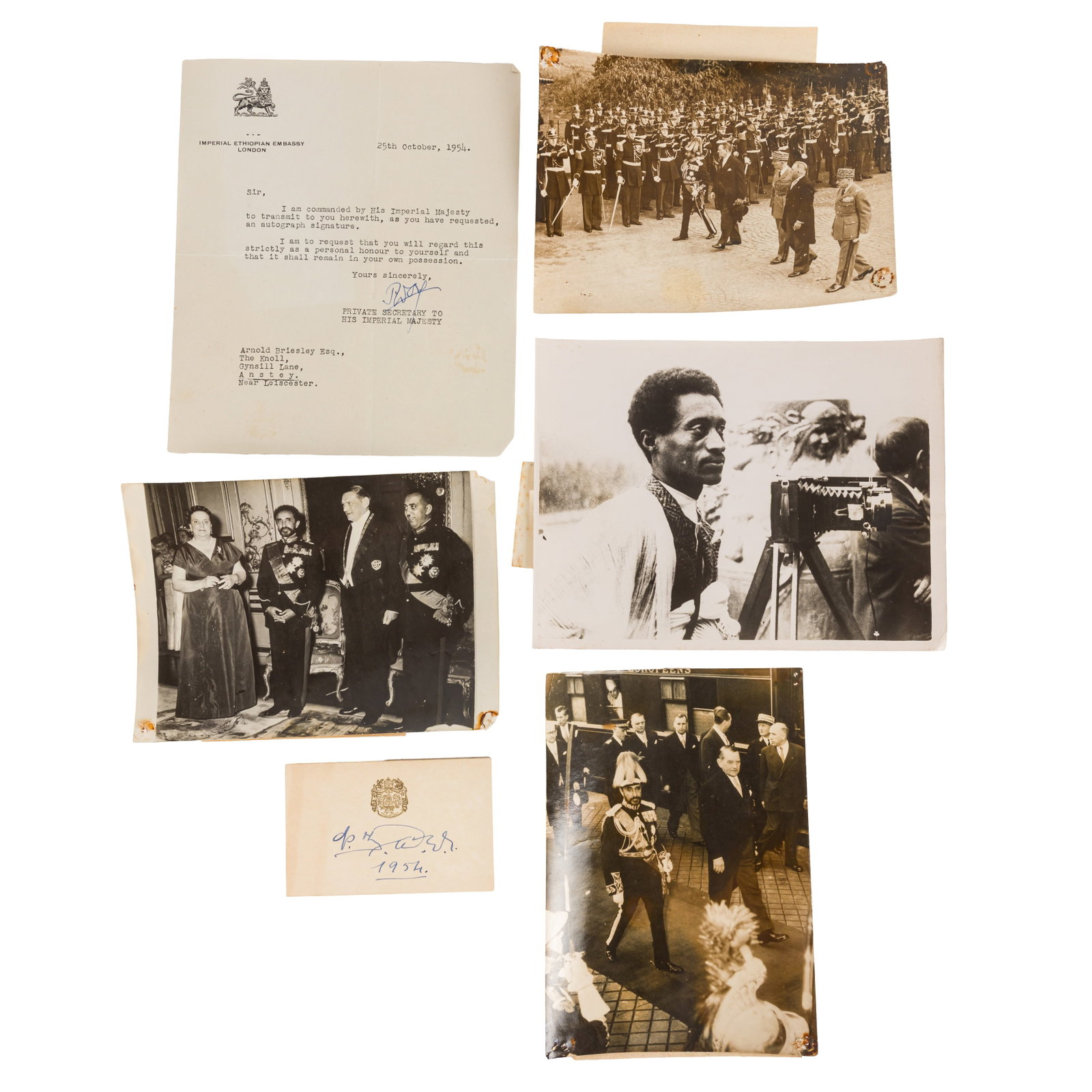 Haile Selassie, Emperor of Ethiopia Ink signature and photographs: Haile Selassie, Emperor of Ethiopia Ink signature and photographs Blue ink signature of Haile Selassie on card bearing gilt Royal crest, also dated 1954, with typed accompanying letter from the Empero