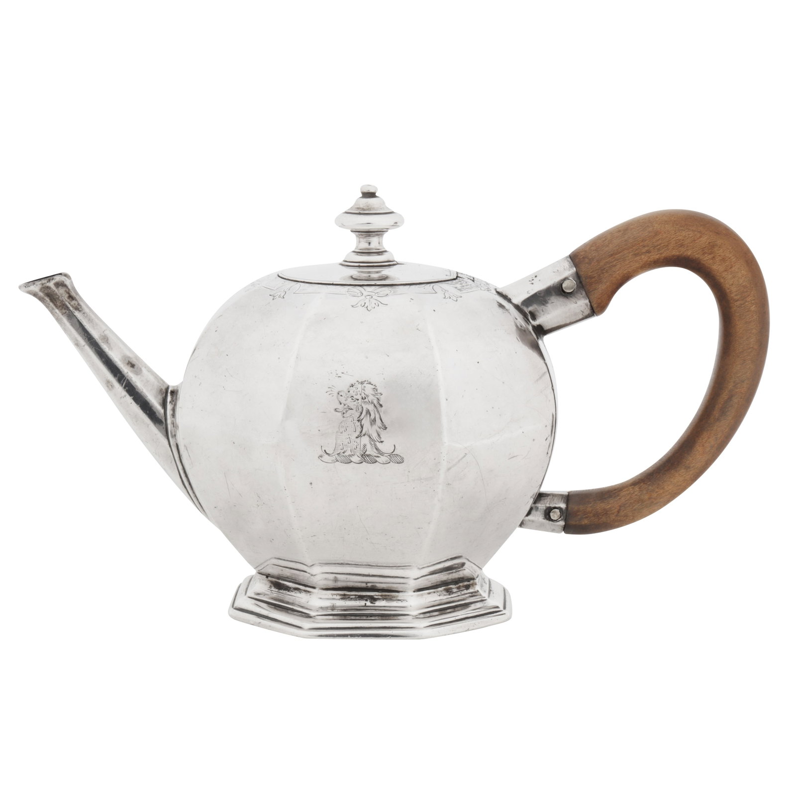 London 1726 by Thomas Tearle A George I sterling silver teapot: Of octagonal ‘bullet’ form upon a spreading octagonal foot, the straight octagonal panelled spout opposite a modern wooden scroll handle. A gently domed hinged lid surmounted by bell form circular