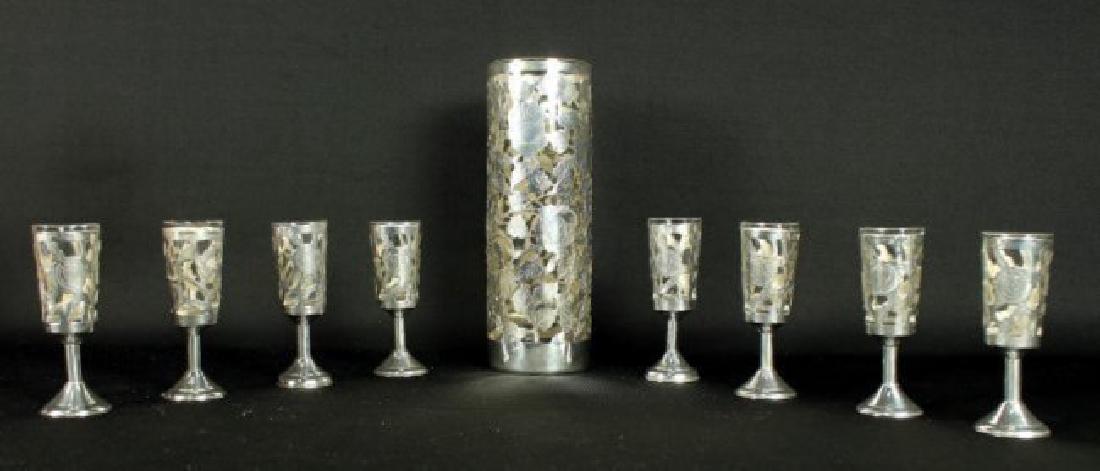 STERLING AND GLASS SHOTS: STERLING AND GLASS SHOTS. MEASURES H: 7 1/2" W: 2 1/2" THE SHOTS MEASURE H: 3 3/4" W: 1" SHIPPING AND HANDLING TO 48 STATES OF UNITED STATES: $60 INTERNATIONAL, ALASKA, HAWAII AND US PROTECTORATES BID