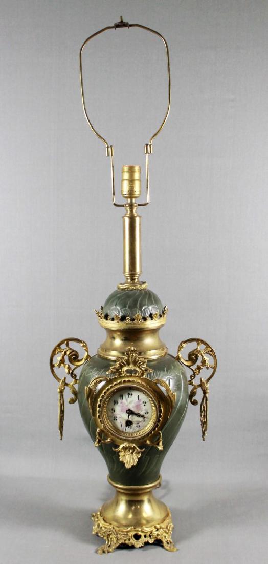 EARLY 20TH C. LAMP WITH CLOCK. PROVENANCE: FROM A NEW (1 of 6)