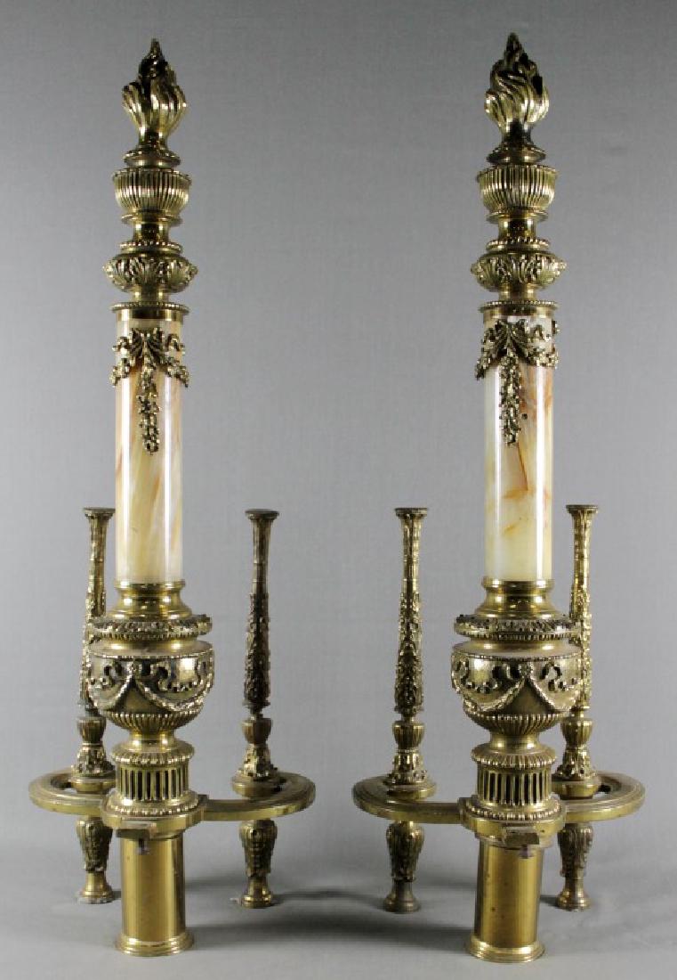 PAIR OF BRASS AND MARBLE ANDIRONS: PAIR OF BRASS AND MARBLE ANDIRONS. MEASURES H: 28" W: 10"