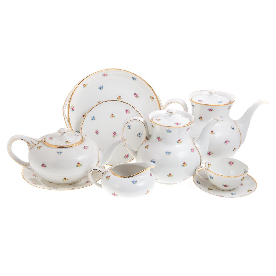 Rosenthal china partial dessert service: 46 pieces, including: 12 dessert plates, 12 teacups, 12 saucers, 2 coffee pots, teapot, 2 trivets, 3 serving dishes, creamer, and a sugar bowl