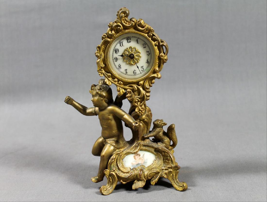 9.5" French Gilt Metal Table Clock in Classical and Art: 9.5" French Gilt Metal Table Clock in Classical and Art Nouveau manner with figural decoration
